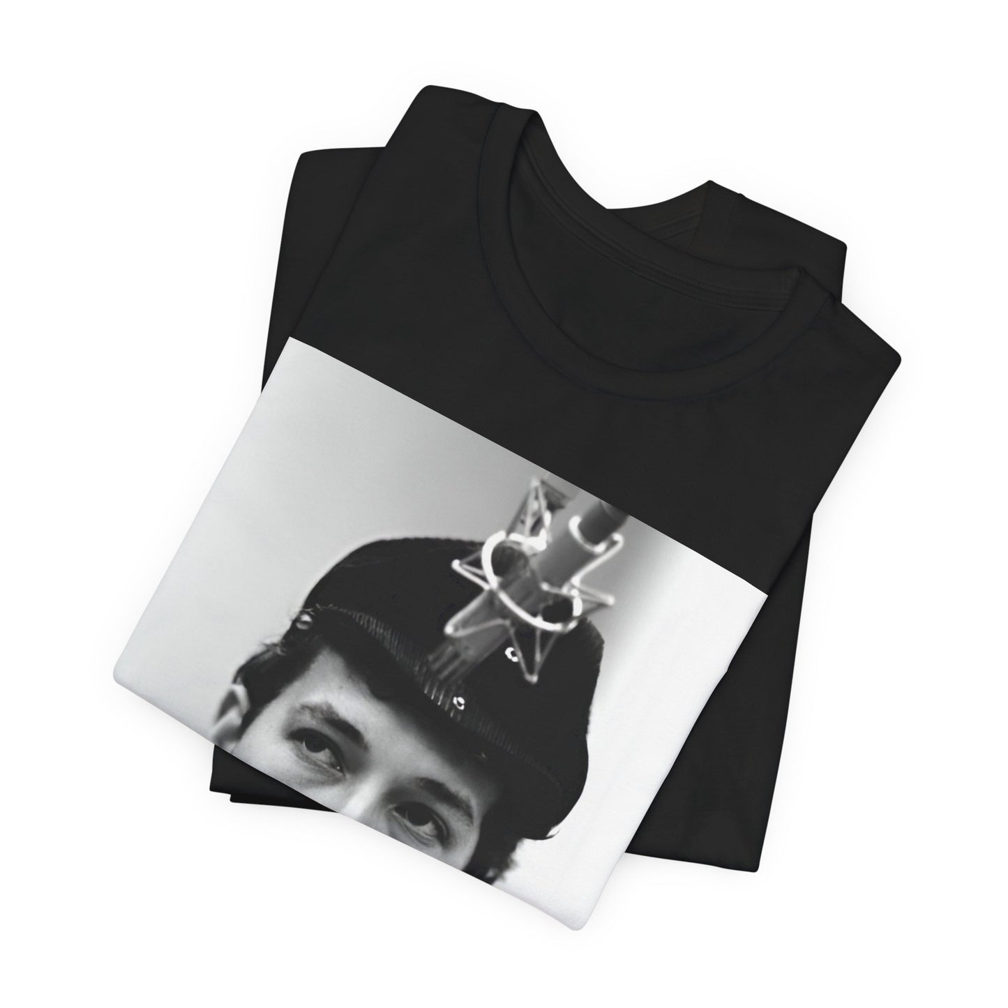 A black graphic t-shirt featuring a graphic of Bob Dylan in an acoustic session setting, possibly with his guitar.