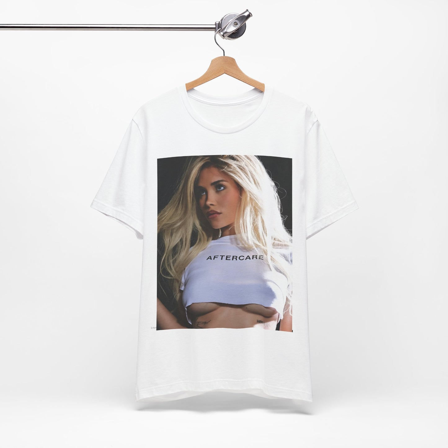A black graphic t-shirt featuring a graphic related to Nessa Barrett's 'Aftercare' themes.