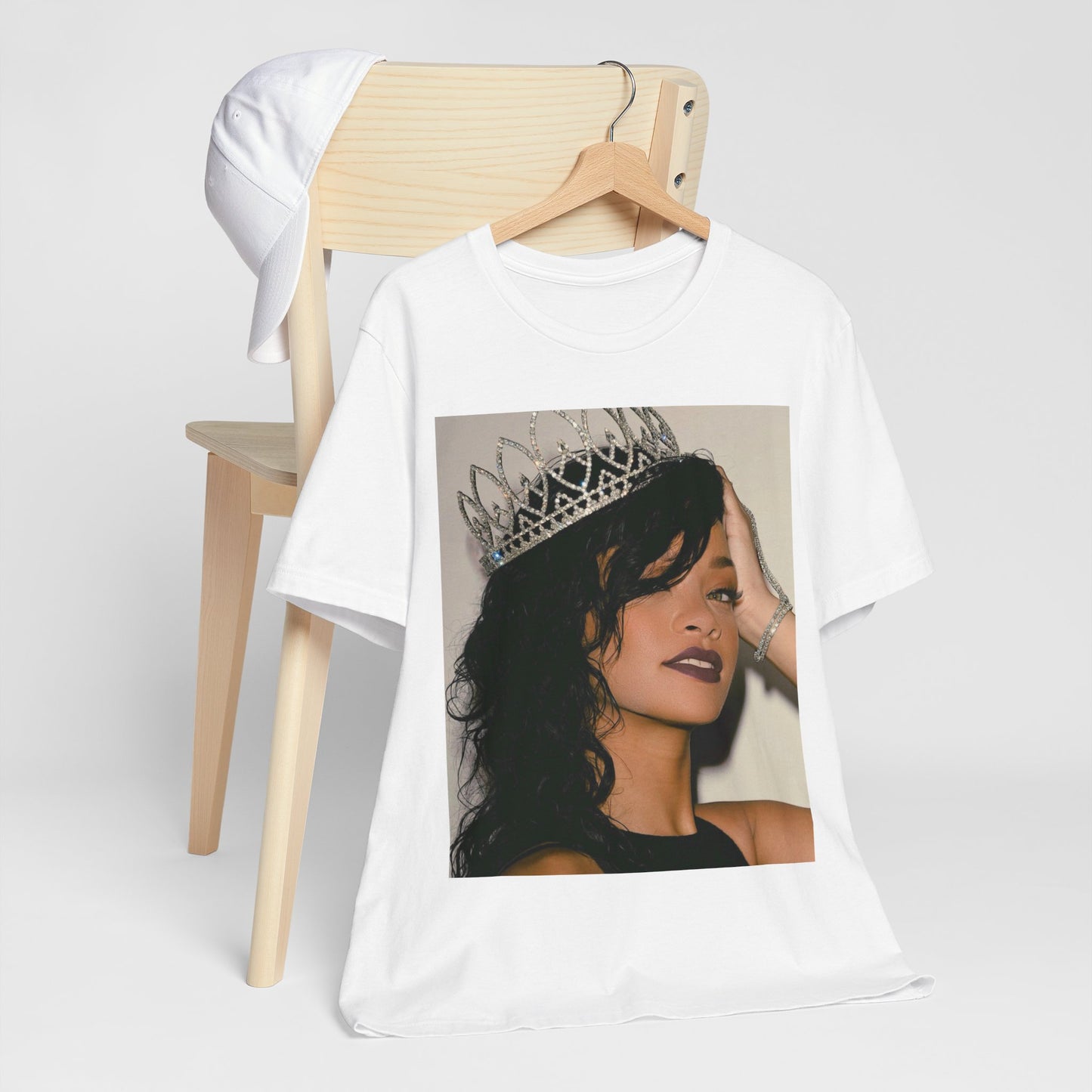 A black graphic t-shirt featuring a Y2K pop aesthetic graphic of Rihanna.
