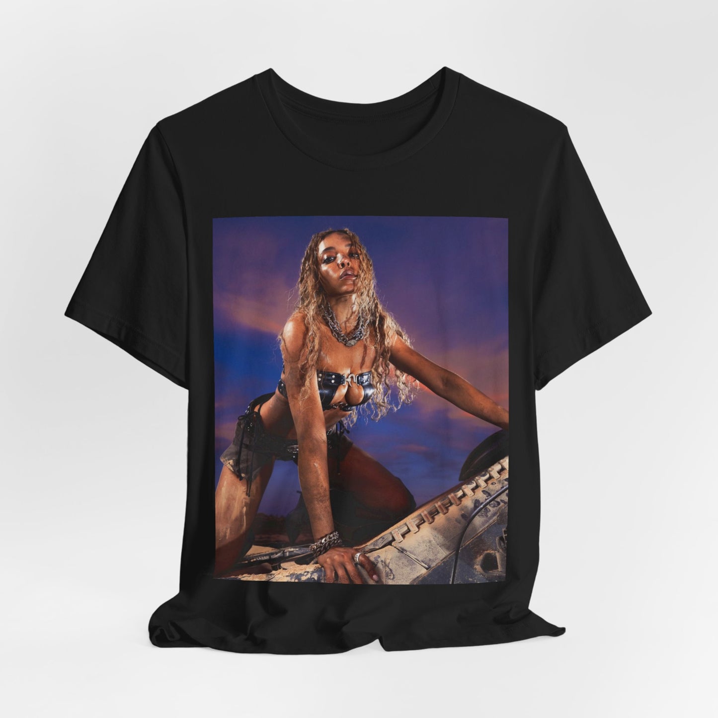 A black graphic t-shirt featuring a vintage graphic related to Tinashe's 'Nasty' era.