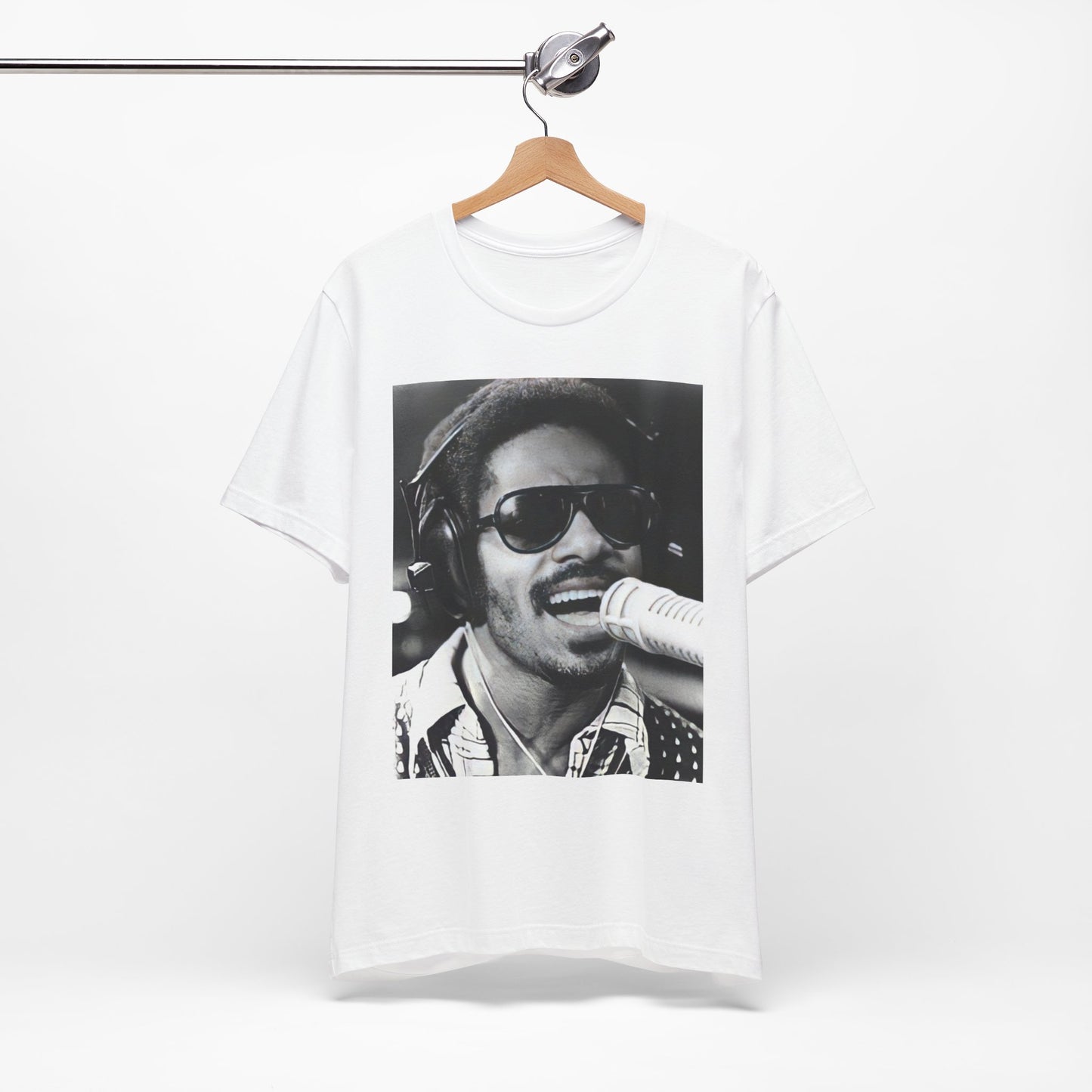 A black graphic t-shirt featuring a graphic of Stevie Wonder as a timeless visionary.