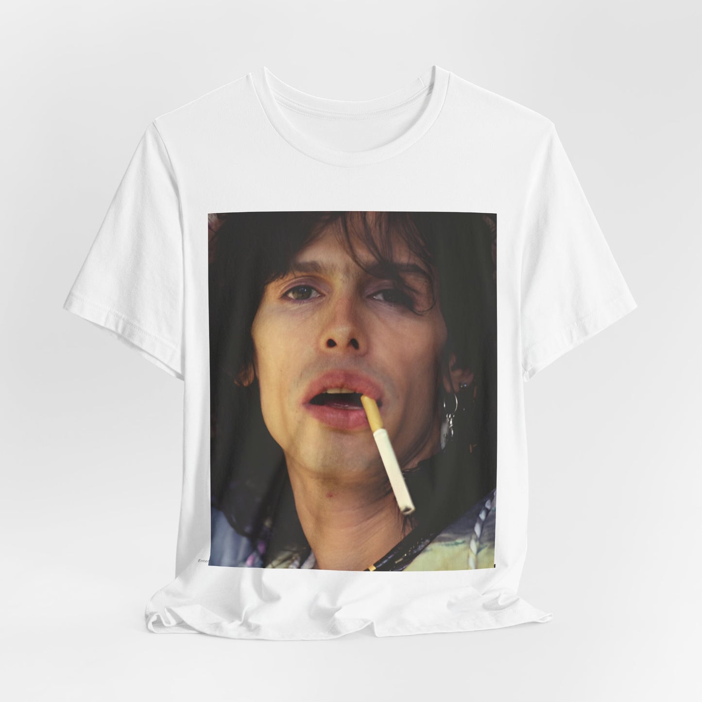A black graphic t-shirt featuring a vintage 70s graphic design related to Aerosmith's 'Dream On' era, possibly with early band member imagery.