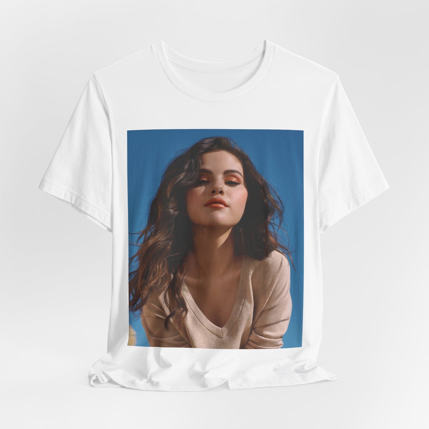 A black graphic t-shirt featuring a vintage pop icon graphic of Selena Gomez.