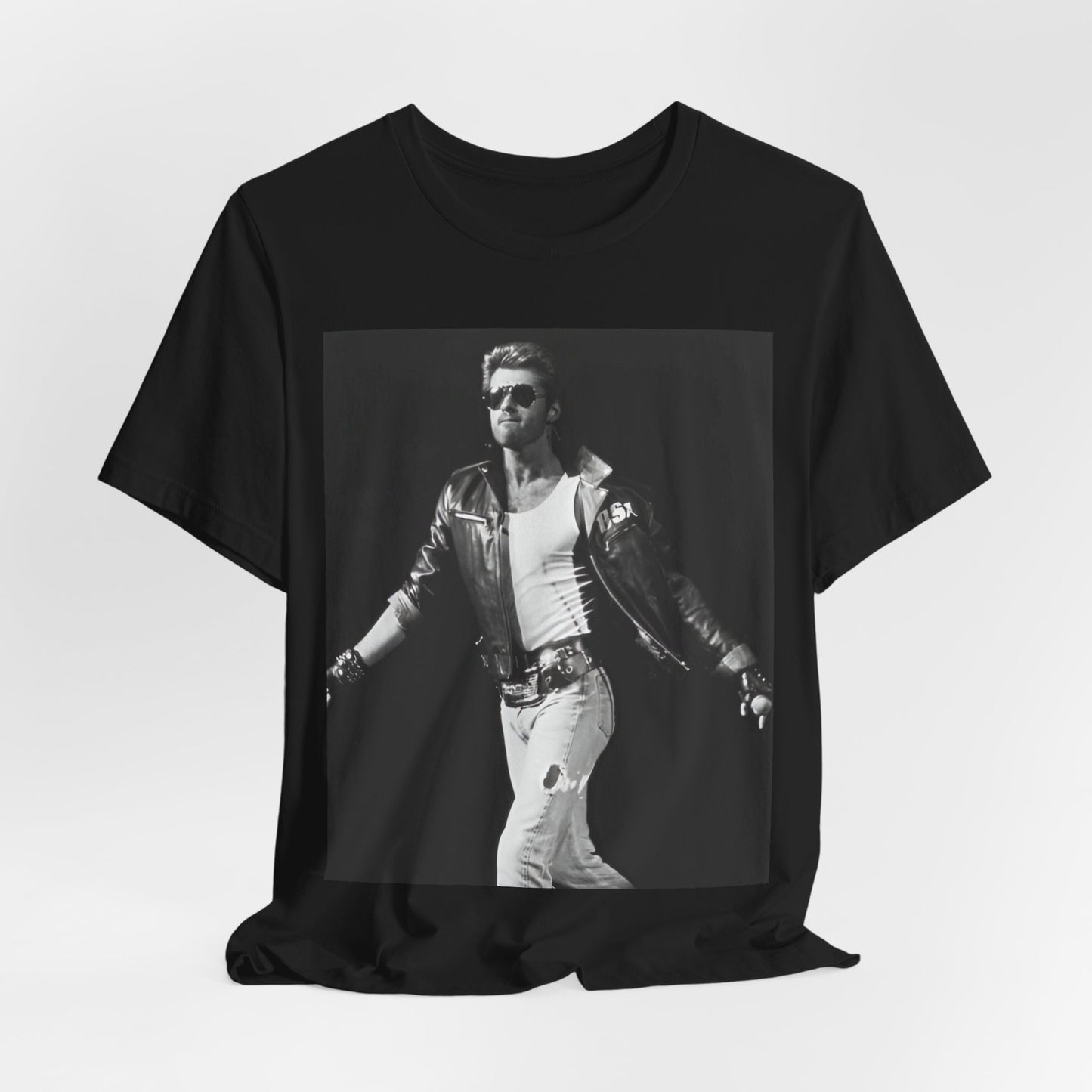 A black graphic t-shirt featuring a retro black and white monochrome graphic or photo of George Michael.
