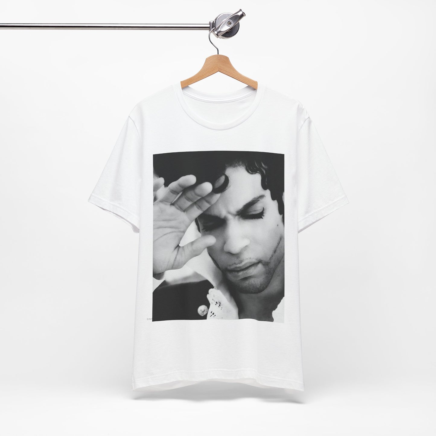 A black graphic t-shirt featuring a black and white graphic or photo portrait of Prince.