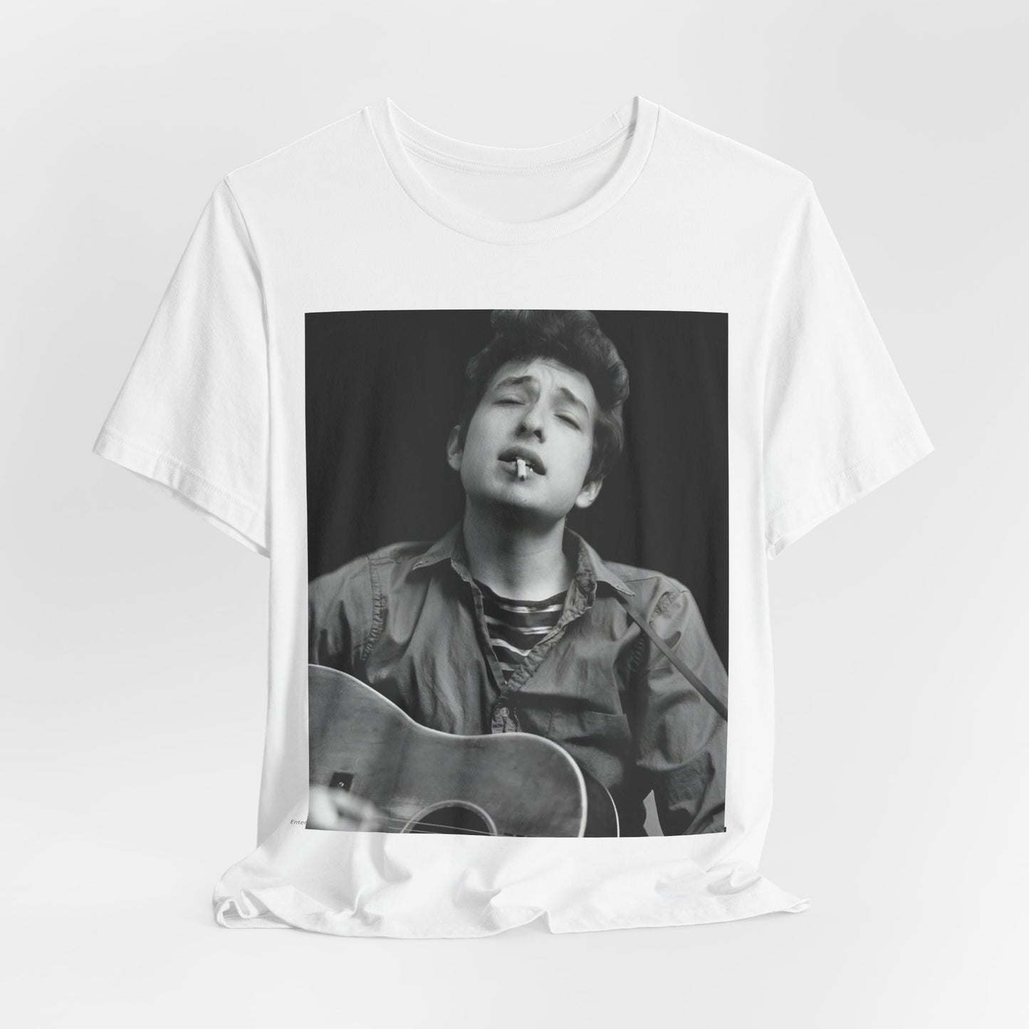 A black graphic t-shirt featuring a photo of Bob Dylan with his acoustic guitar.