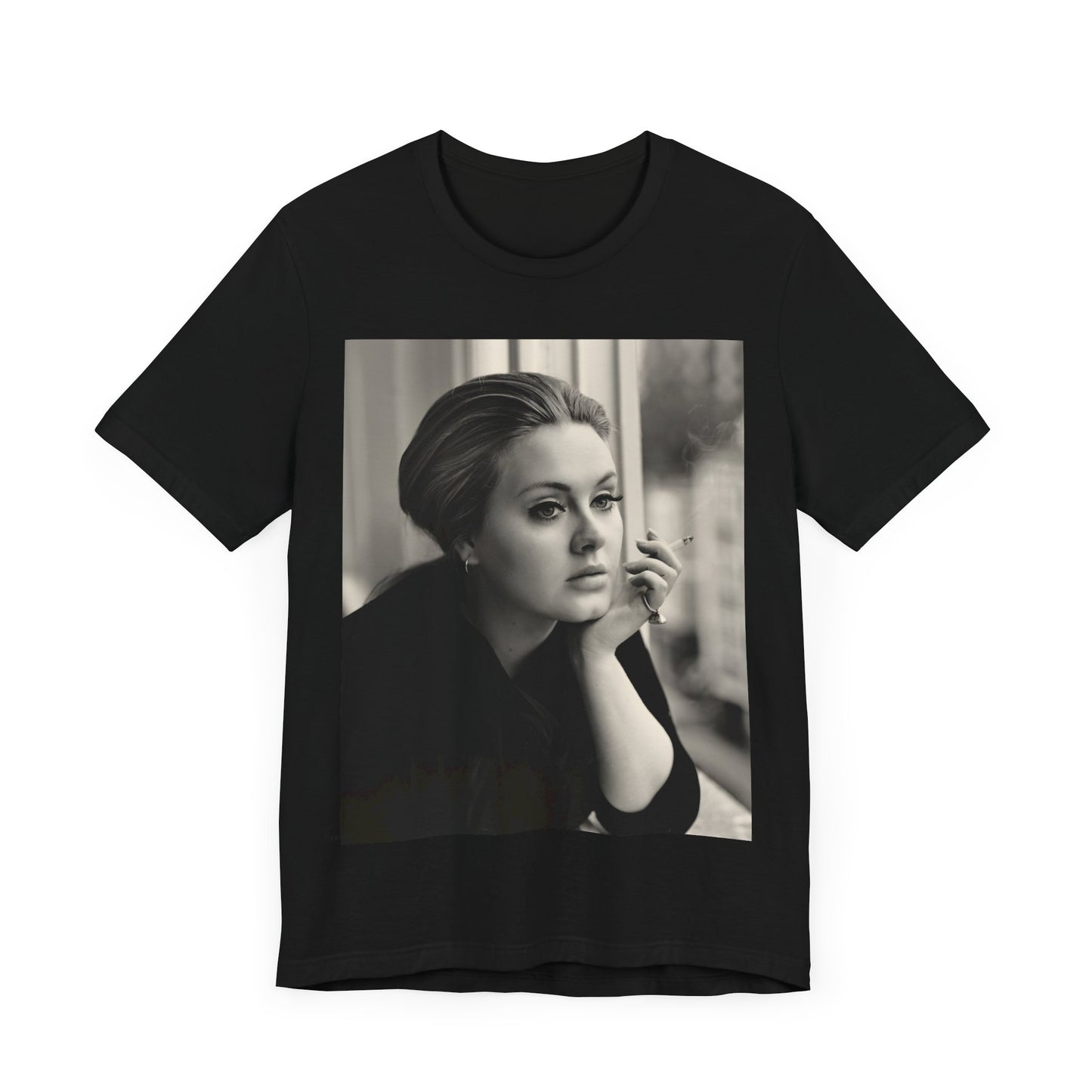 A black graphic t-shirt featuring a black and white photo of Adele, showing her with a serene or thoughtful expression.
