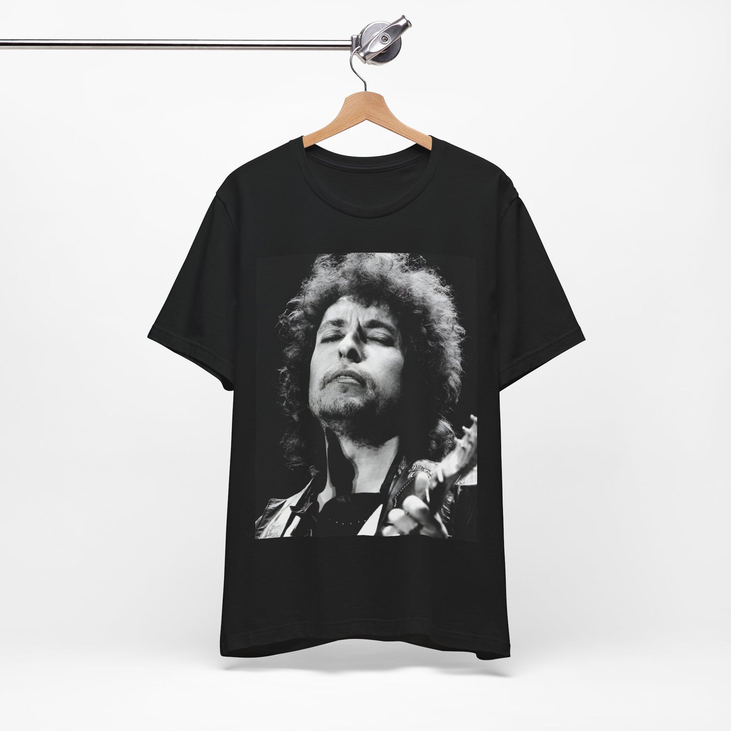 A black graphic t-shirt featuring a retro black and white graphic or photo of Bob Dylan performing live.