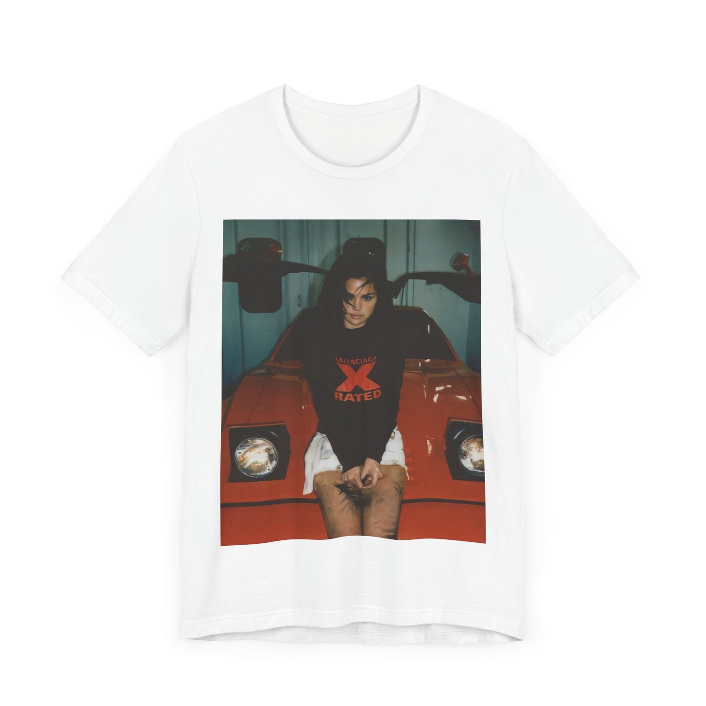 A black graphic t-shirt featuring a photo or graphic of Selena Gomez with a car, designed with an 'X Rated' or edgy aesthetic.