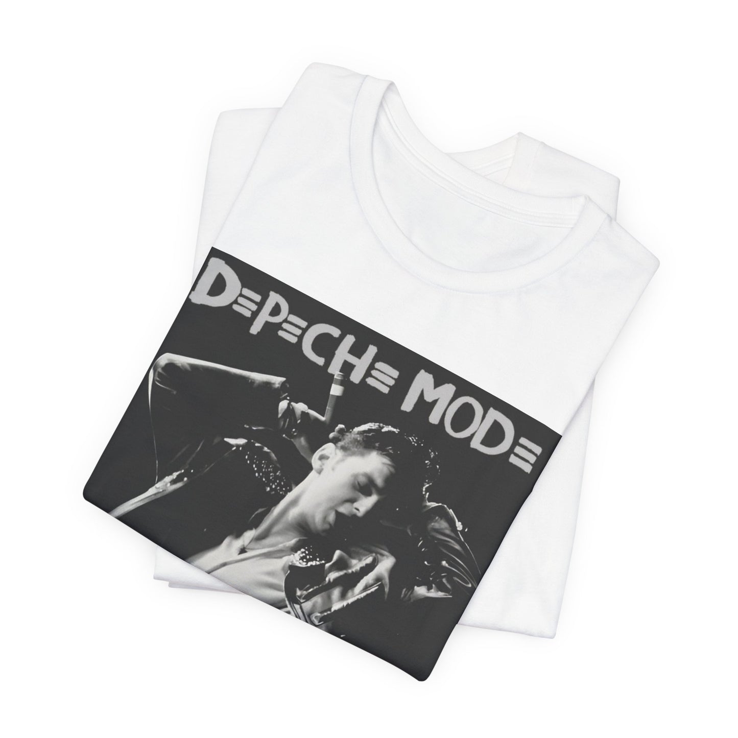 A black graphic t-shirt featuring a black and white graphic or photo of Depeche Mode performing live on stage.
