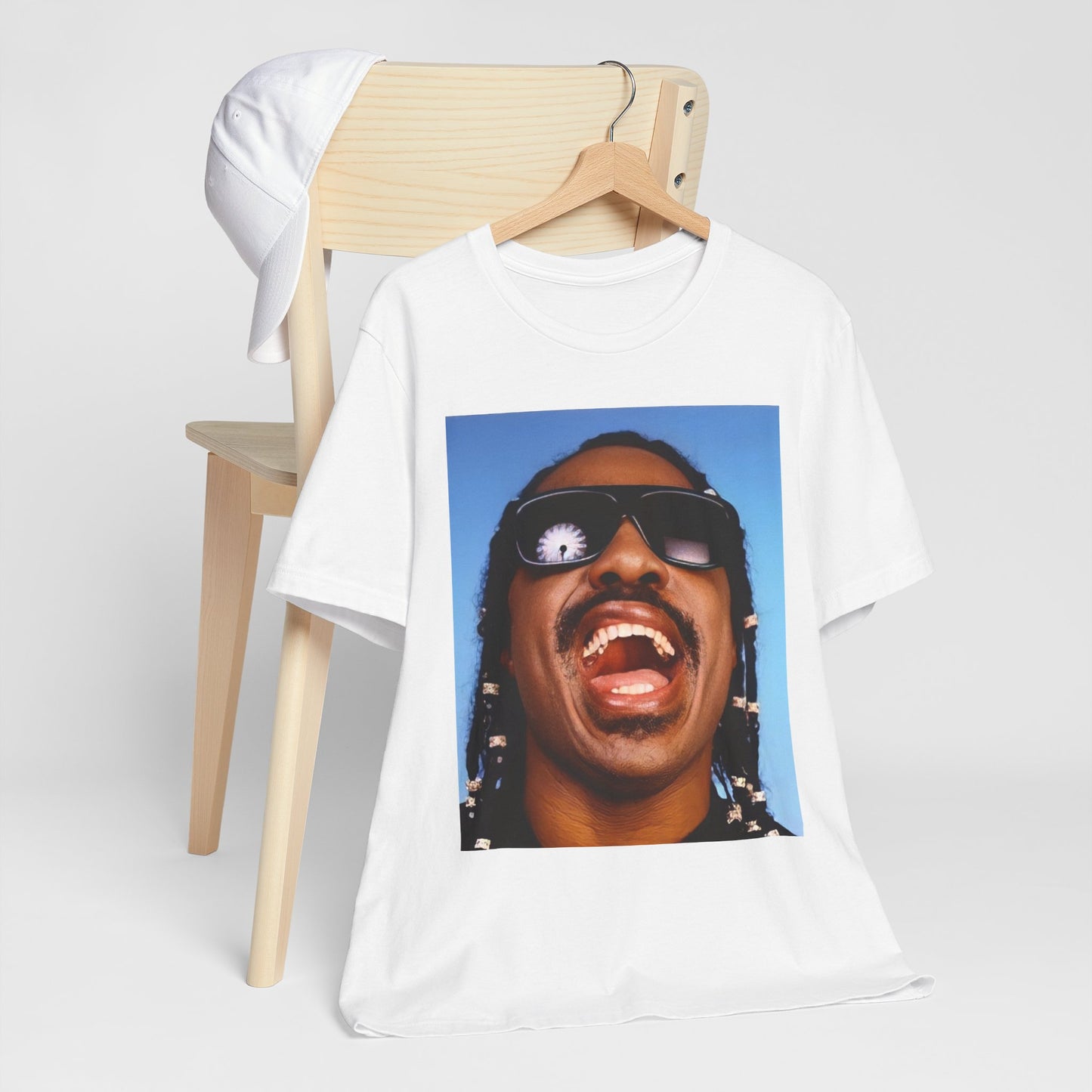 A black graphic t-shirt featuring a bold soul superstar graphic of Stevie Wonder.