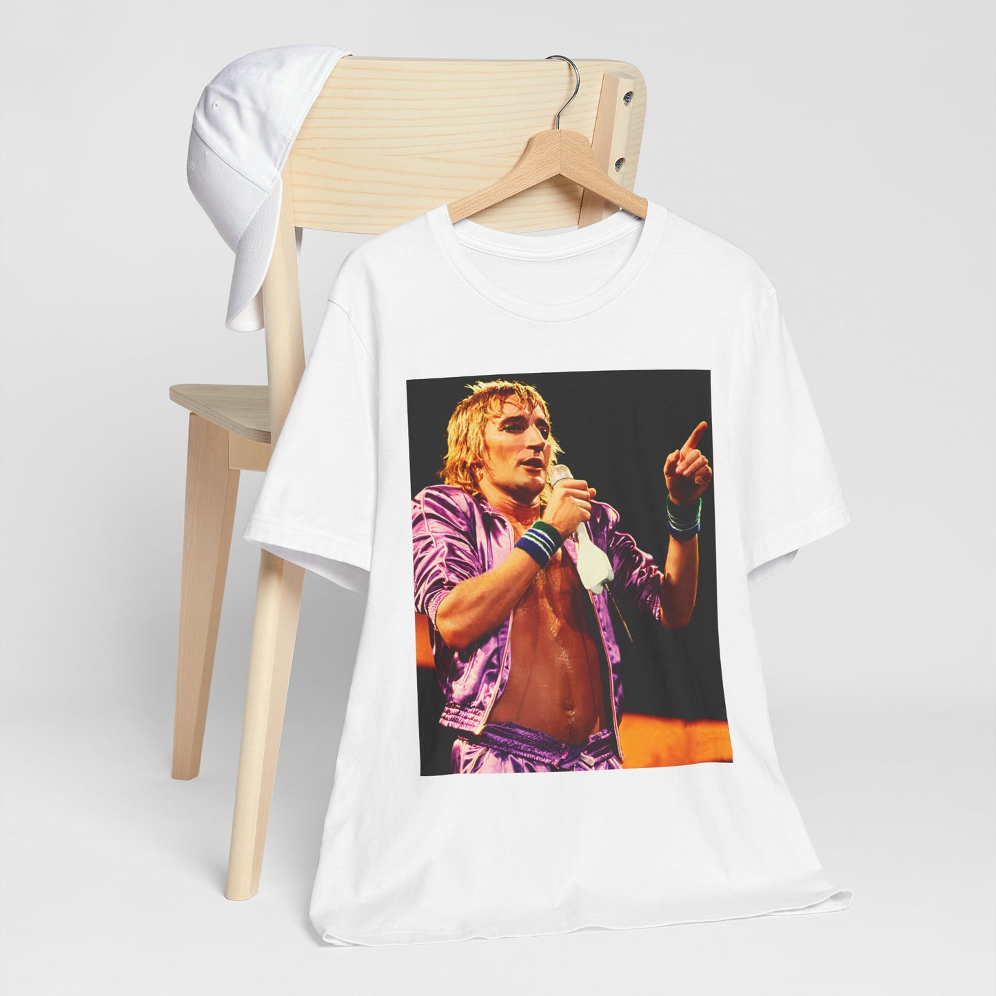 A black graphic t-shirt featuring a graphic of Rod Stewart with a chill 70s rock aesthetic.