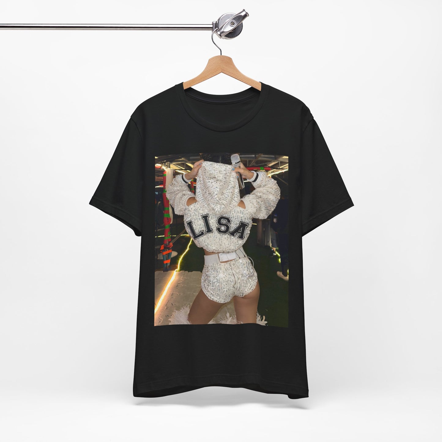 A black graphic t-shirt featuring a graphic or photo of Lisa in a backstage setting.