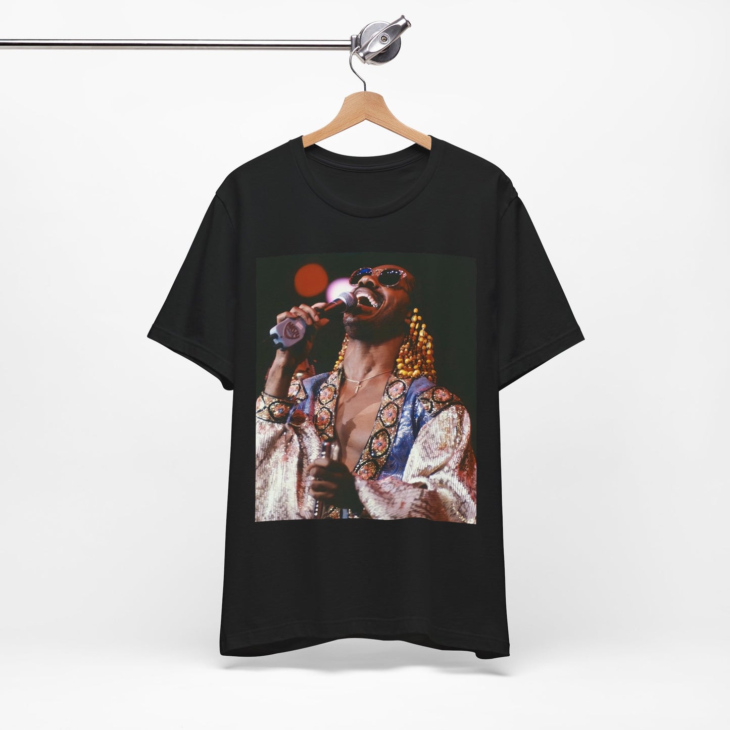 A black graphic t-shirt featuring a 70s vintage soul icon graphic of Stevie Wonder.