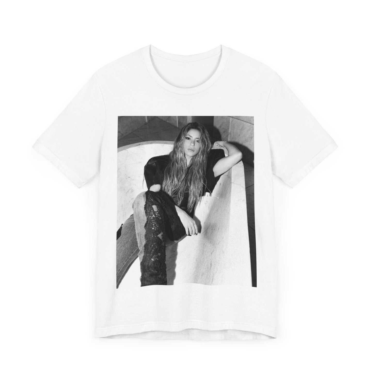 A black graphic t-shirt featuring a retro graphic related to Shakira's 'Hips Don't Lie' song or era.