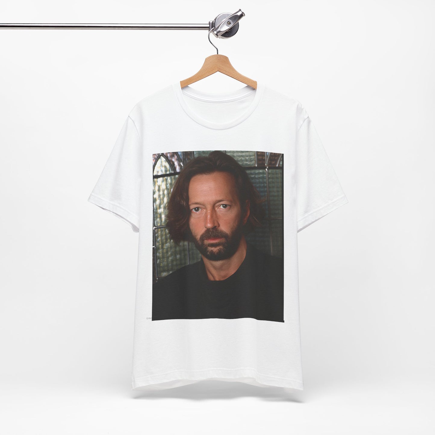 A black graphic t-shirt featuring a portrait graphic of Eric Clapton as a guitar god legend.