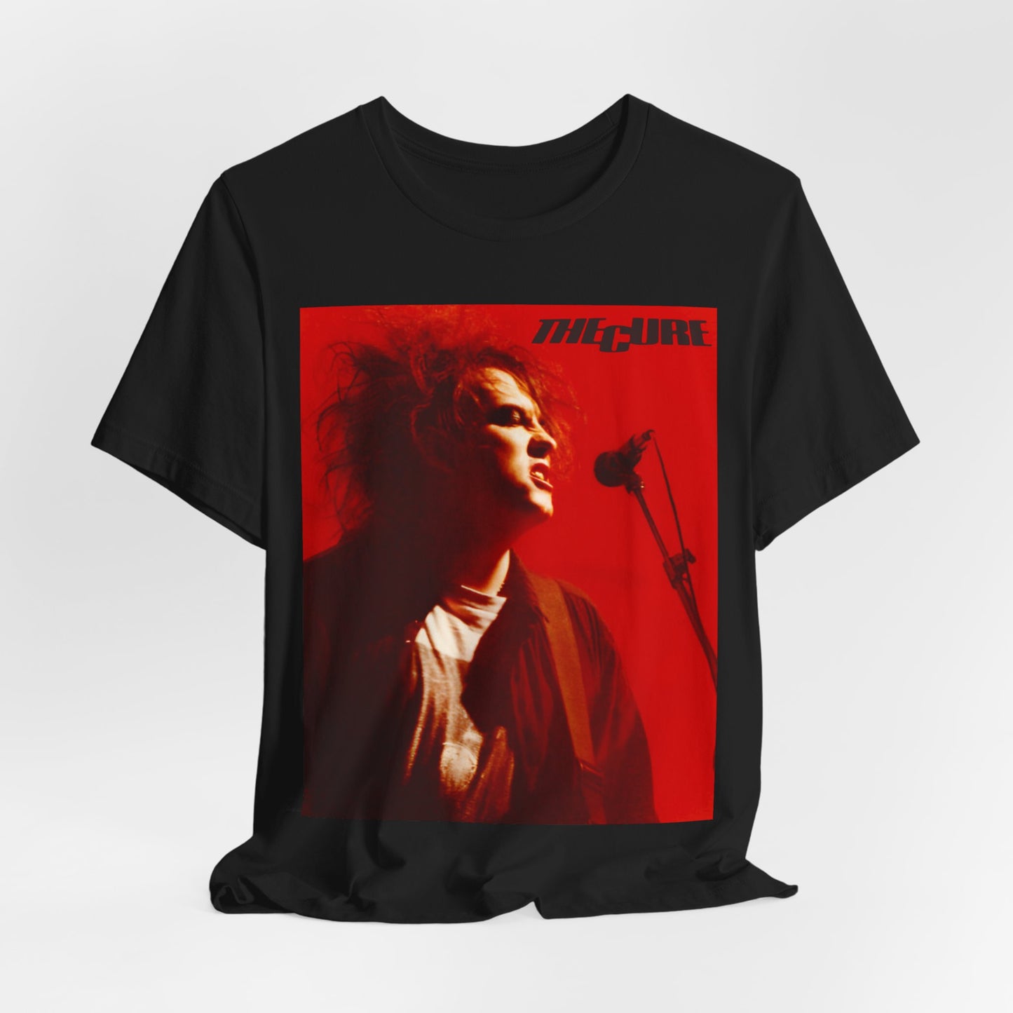 A black graphic t-shirt featuring a graphic of Robert Smith from The Cure with iconic red lipstick.