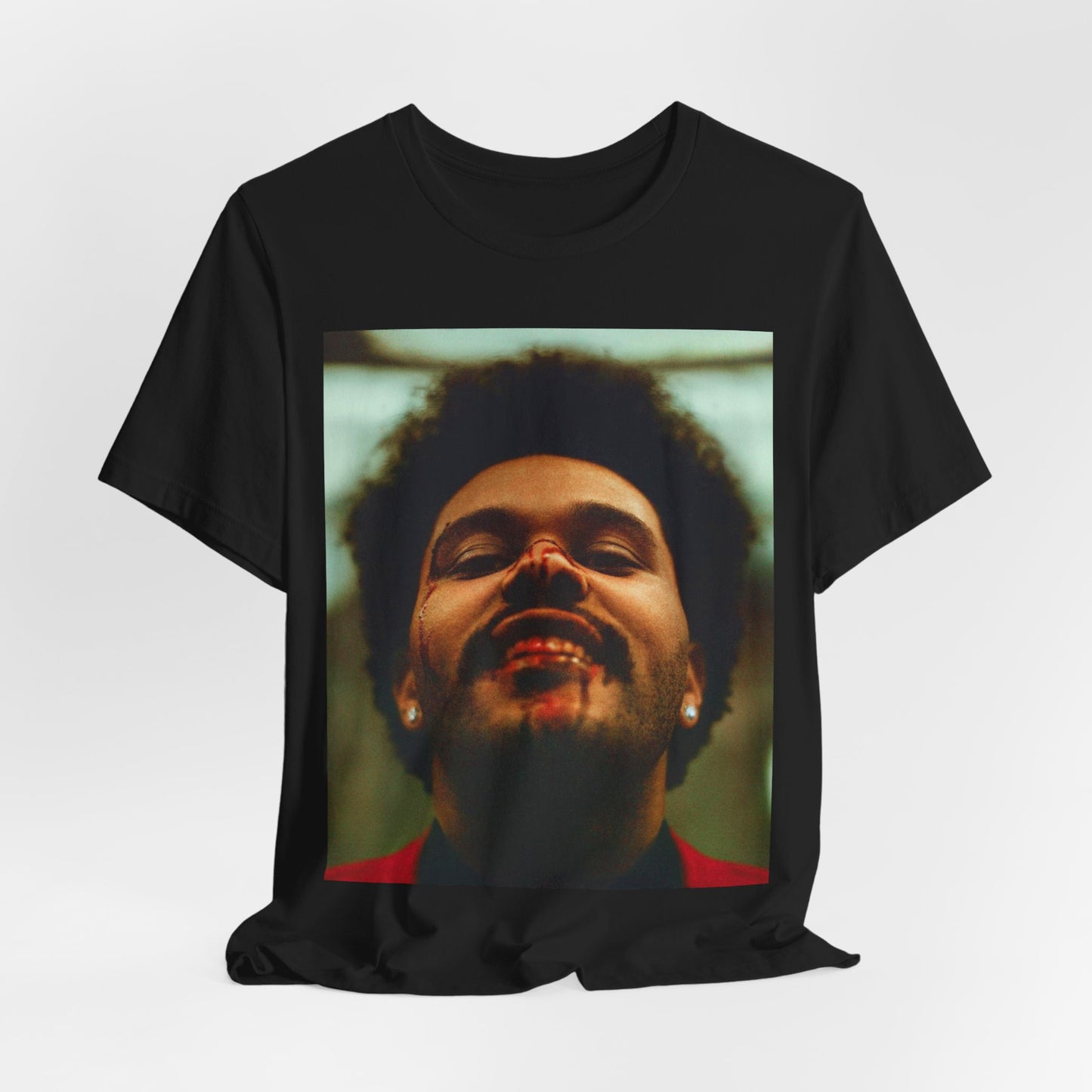 A black graphic t-shirt featuring the album cover art for The Weeknd's 'After Hours'.