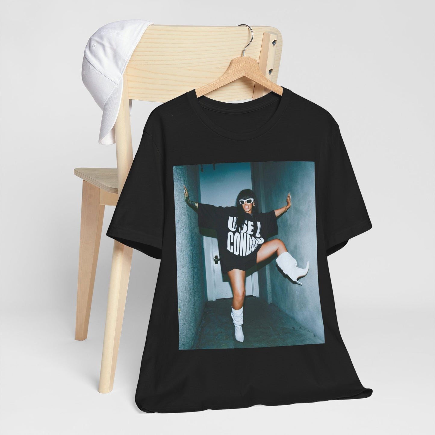 A black graphic t-shirt featuring a modern pop essential graphic of Rihanna.