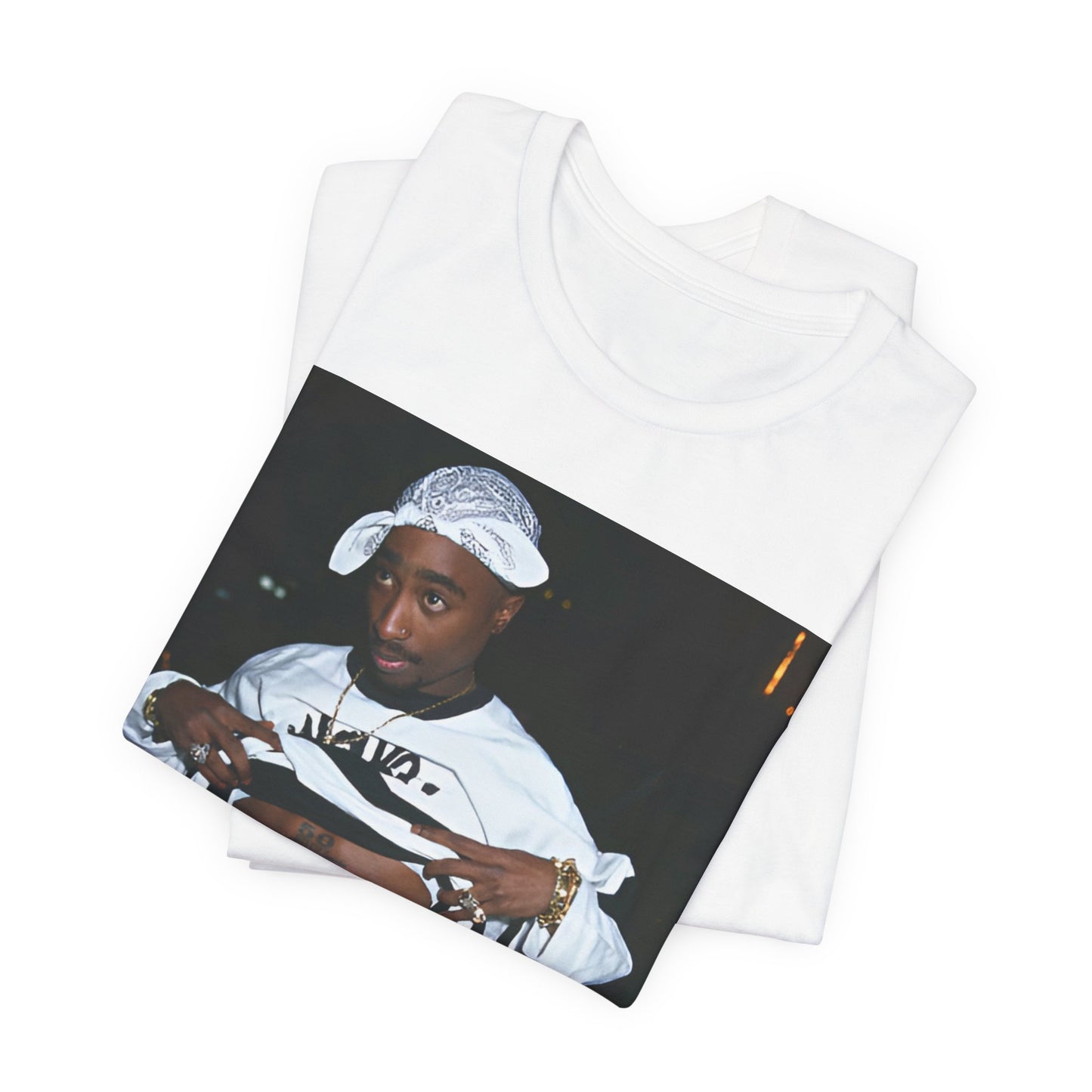 A black graphic t-shirt featuring a graphic of Tupac Shakur (2Pac).