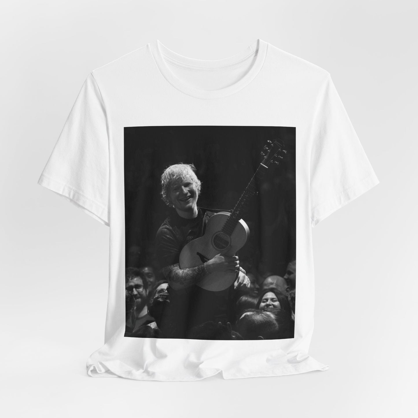 A black graphic t-shirt featuring a photo of Ed Sheeran performing live with his guitar.