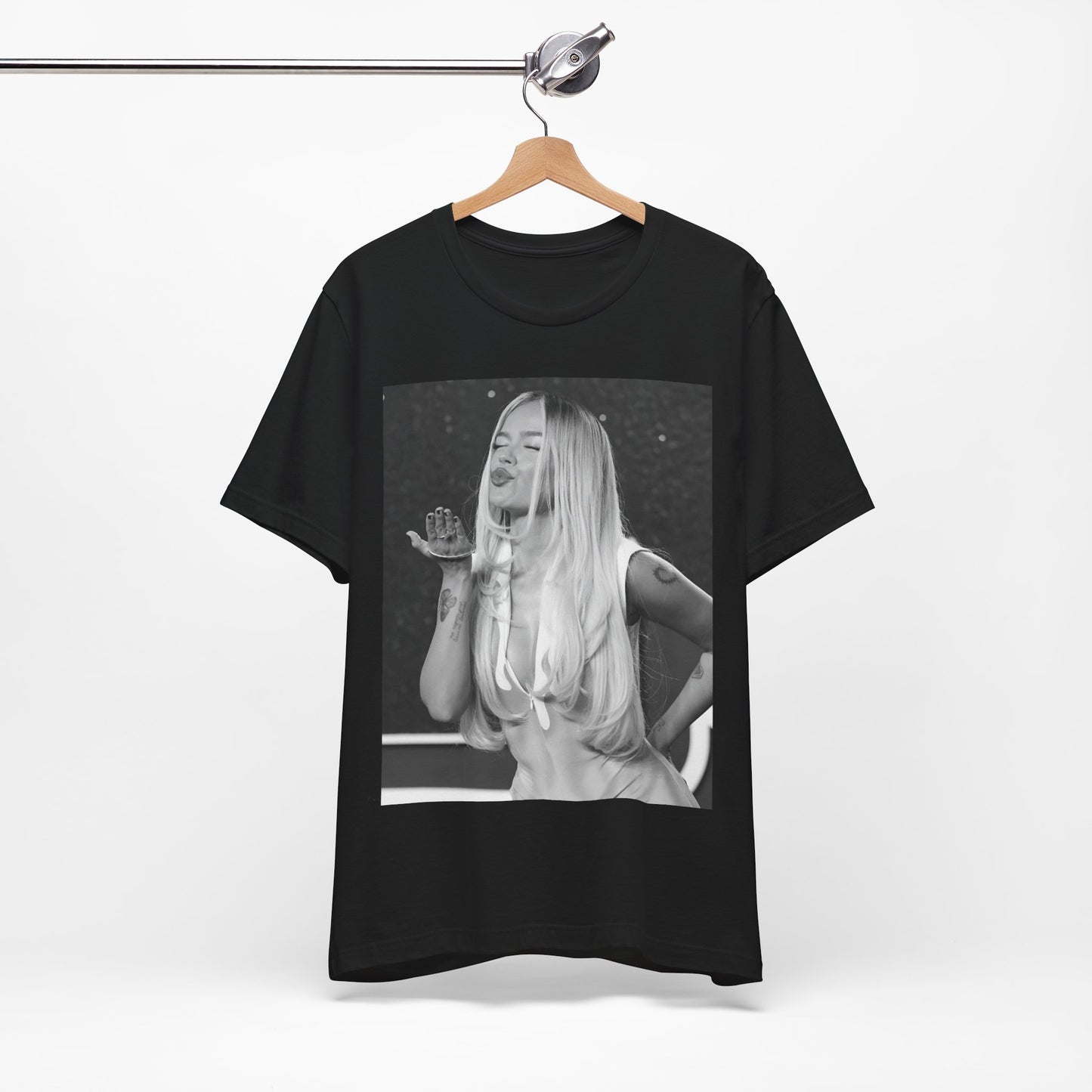 A black graphic t-shirt featuring a graphic of Karol G with a 'La Bichota Kiss' theme.