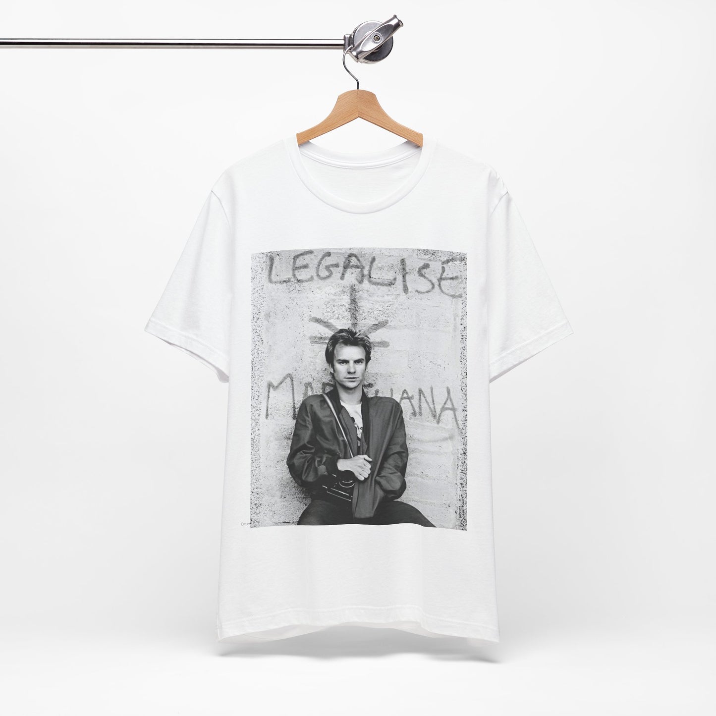 A black graphic t-shirt featuring a graphic of The Police with reggae-influenced pop elements.
