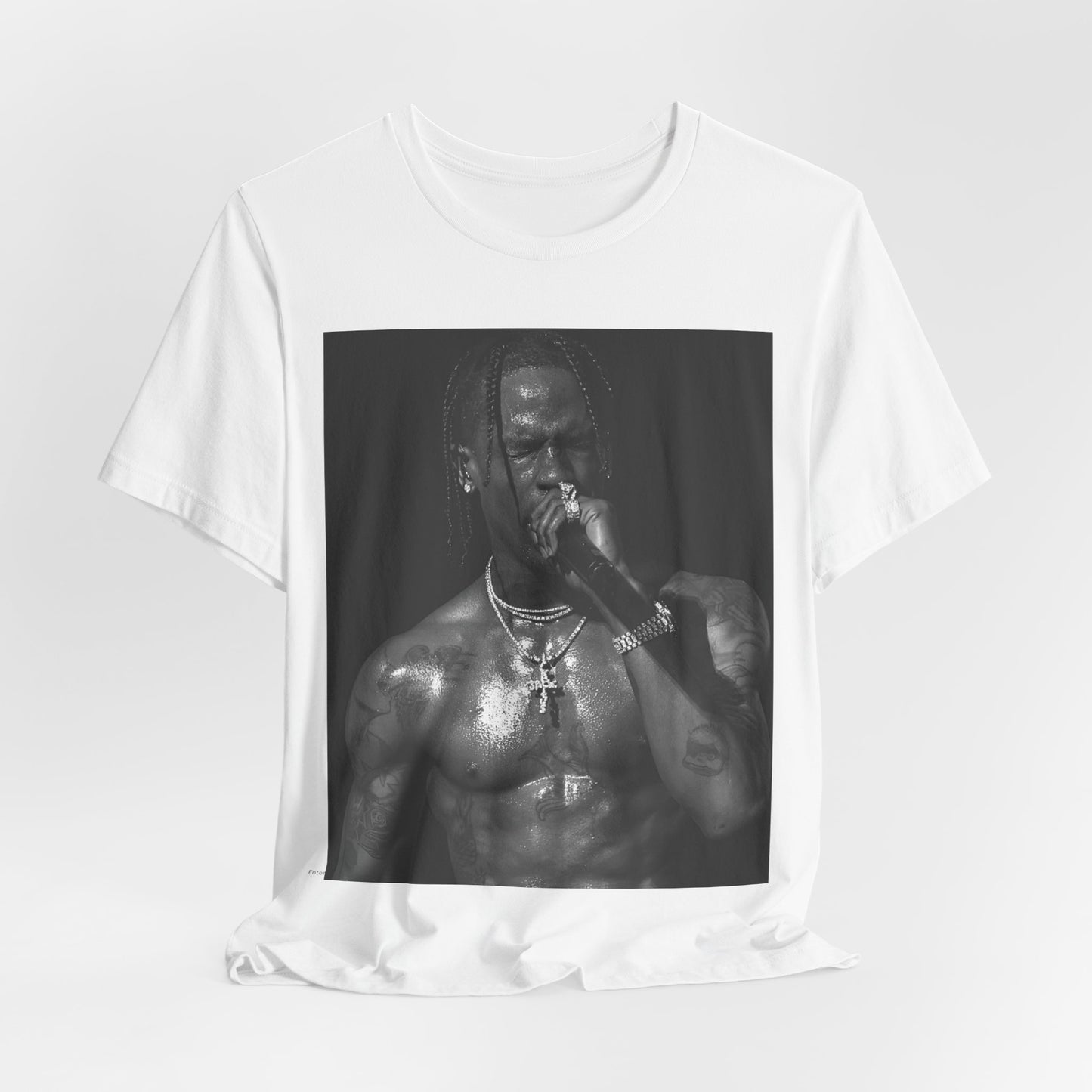 A black graphic t-shirt featuring an underground hip hop graphic of Travis Scott.