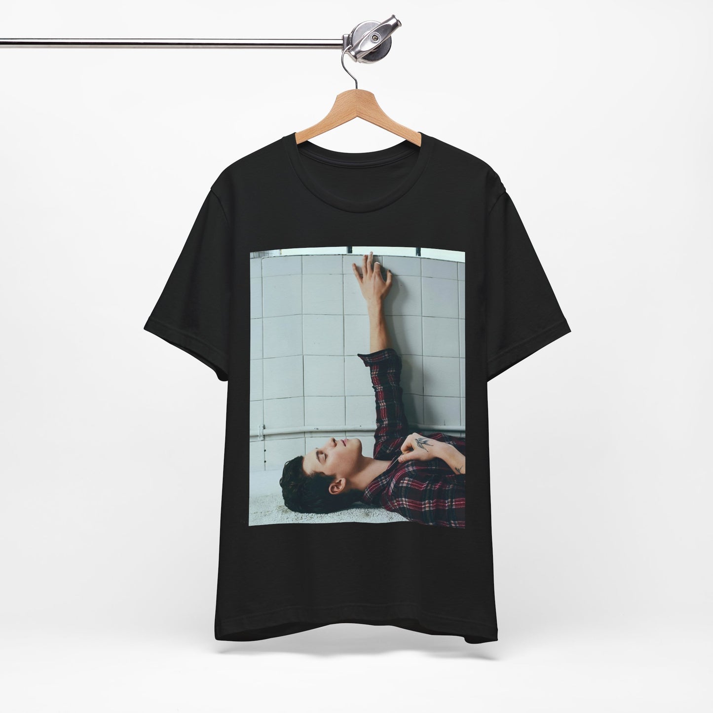 A black graphic t-shirt featuring a bold graphic of Shawn Mendes as a superstar.