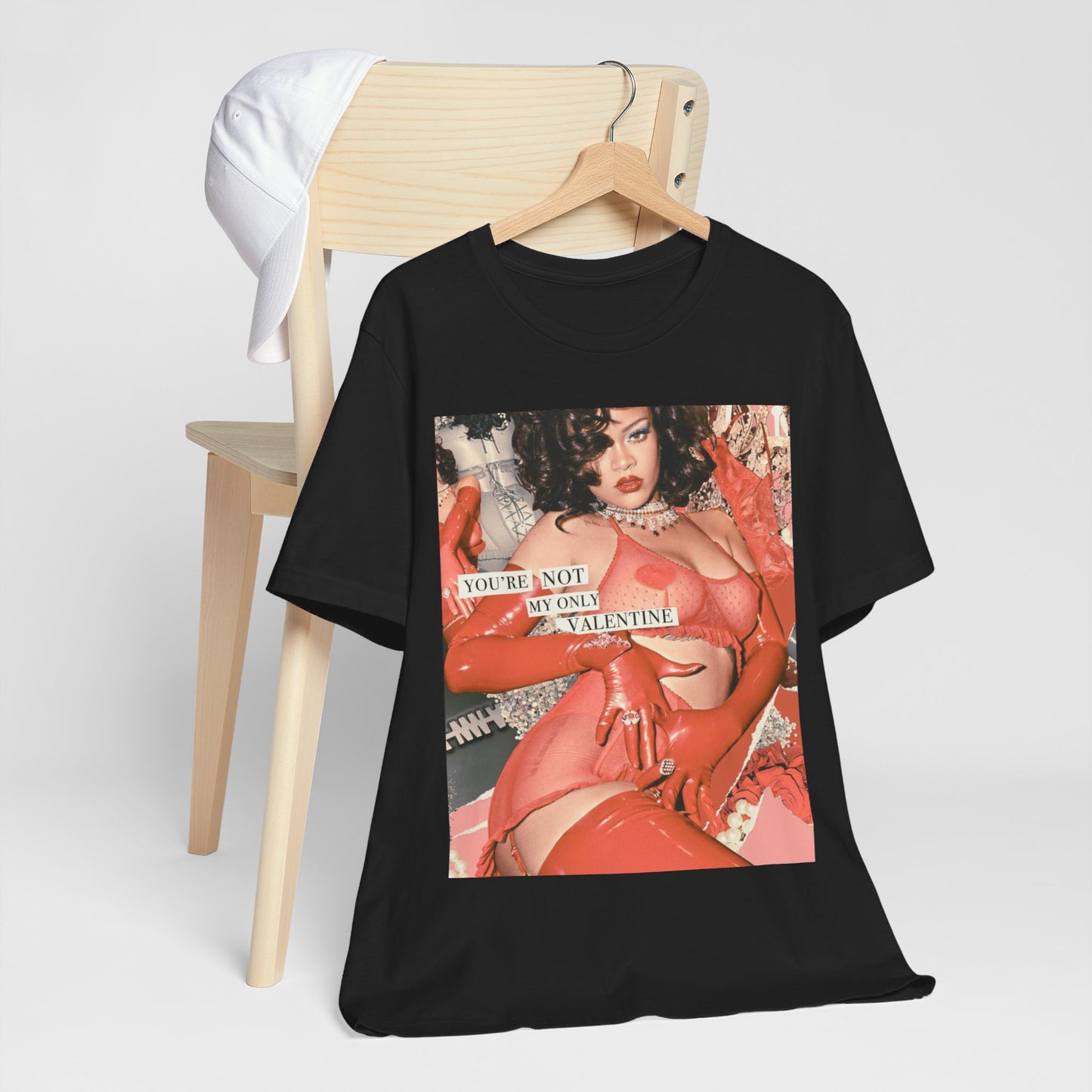 A black graphic t-shirt featuring a graphic of Rihanna with a 'hot valentine' theme.