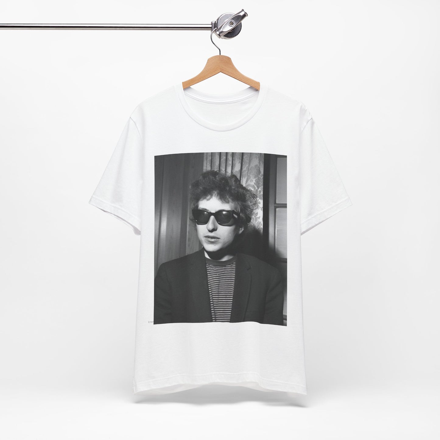 A black graphic t-shirt featuring a graphic related to Bob Dylan's 'The Freewheelin' album era.