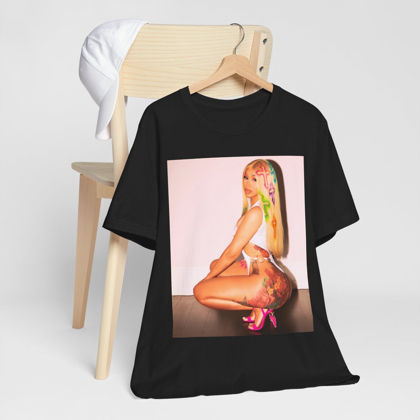 A black graphic t-shirt featuring a graphic of Cardi B in a bold, fashion-forward pose, emphasizing her 'fashion killa' style.