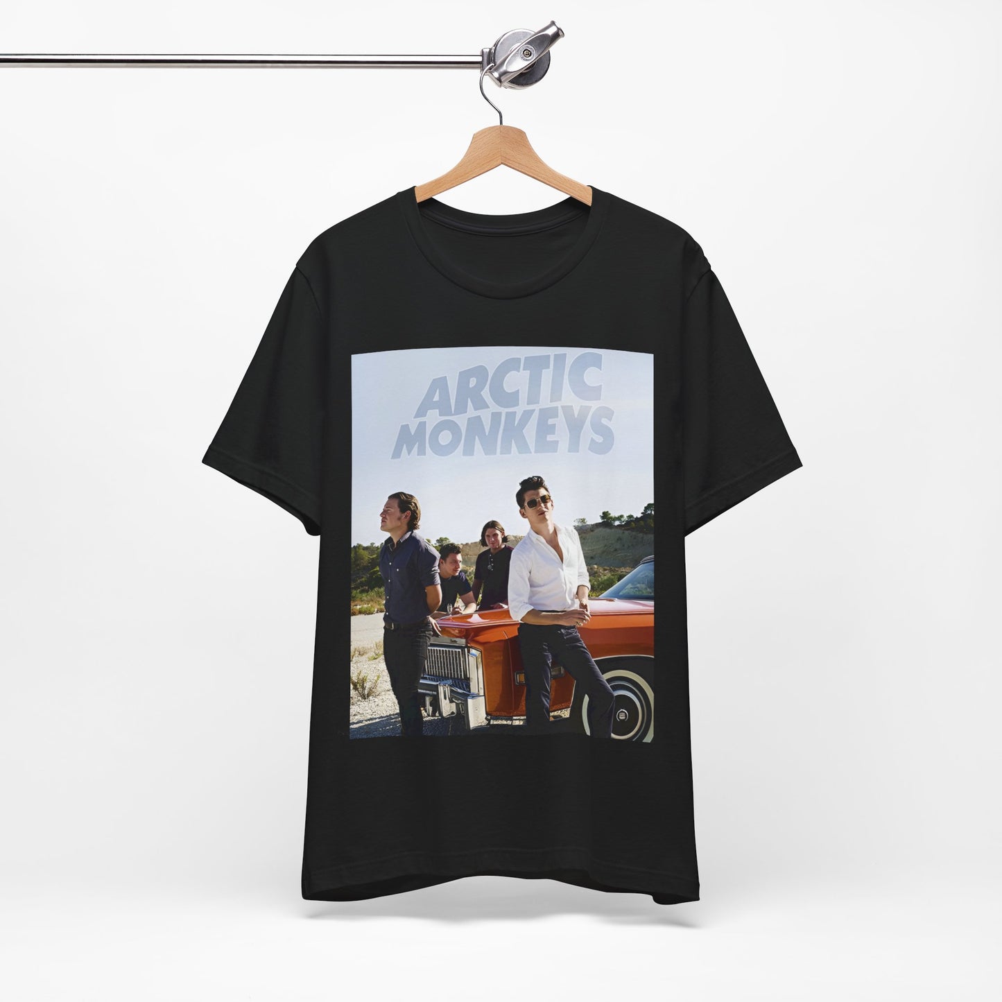 A black graphic t-shirt featuring a design related to Arctic Monkeys' 'AM' album era, possibly with the album art or band imagery.