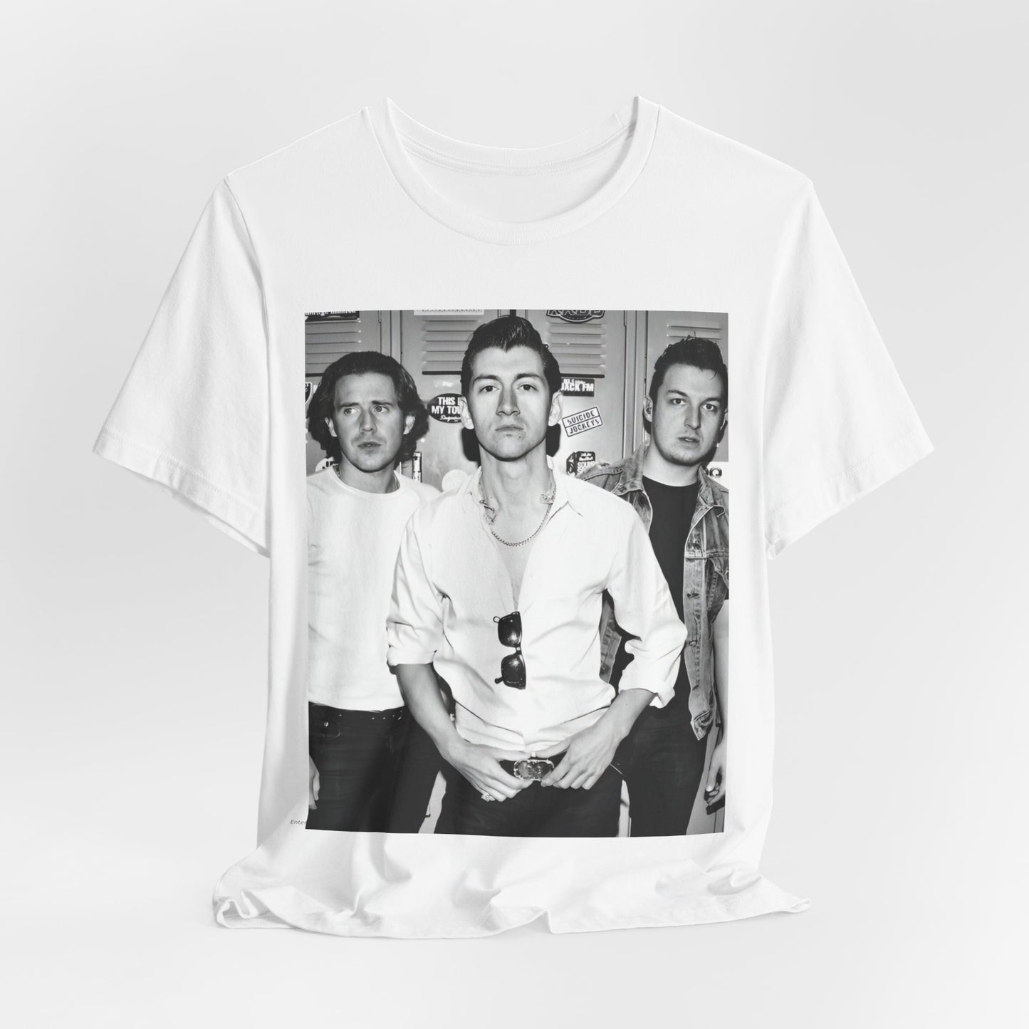 A black graphic t-shirt featuring a vintage-style design related to Arctic Monkeys' 'AM' album era, possibly with the album art or band imagery.