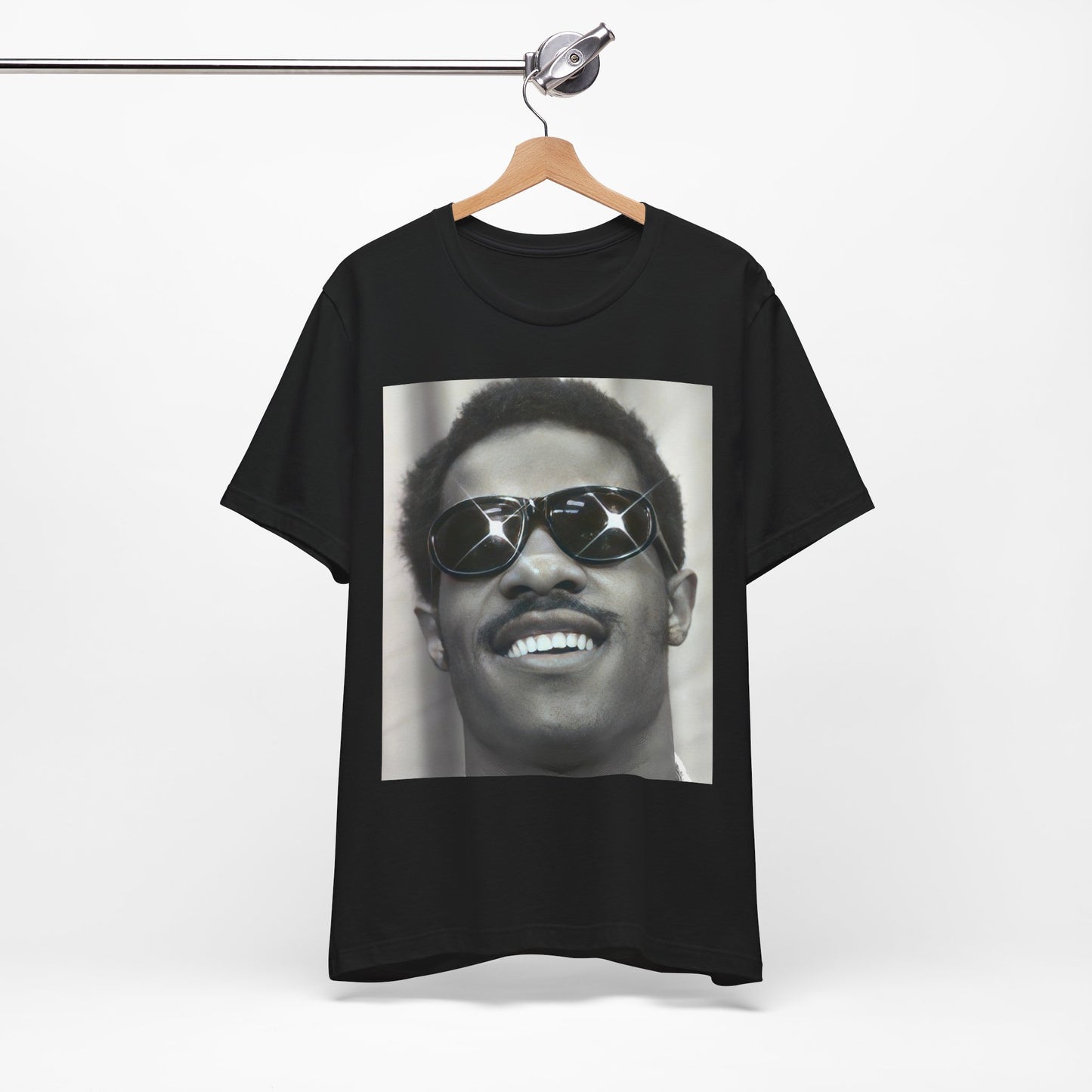 A black graphic t-shirt featuring a 70s funk aesthetic black and white graphic or photo of Stevie Wonder.