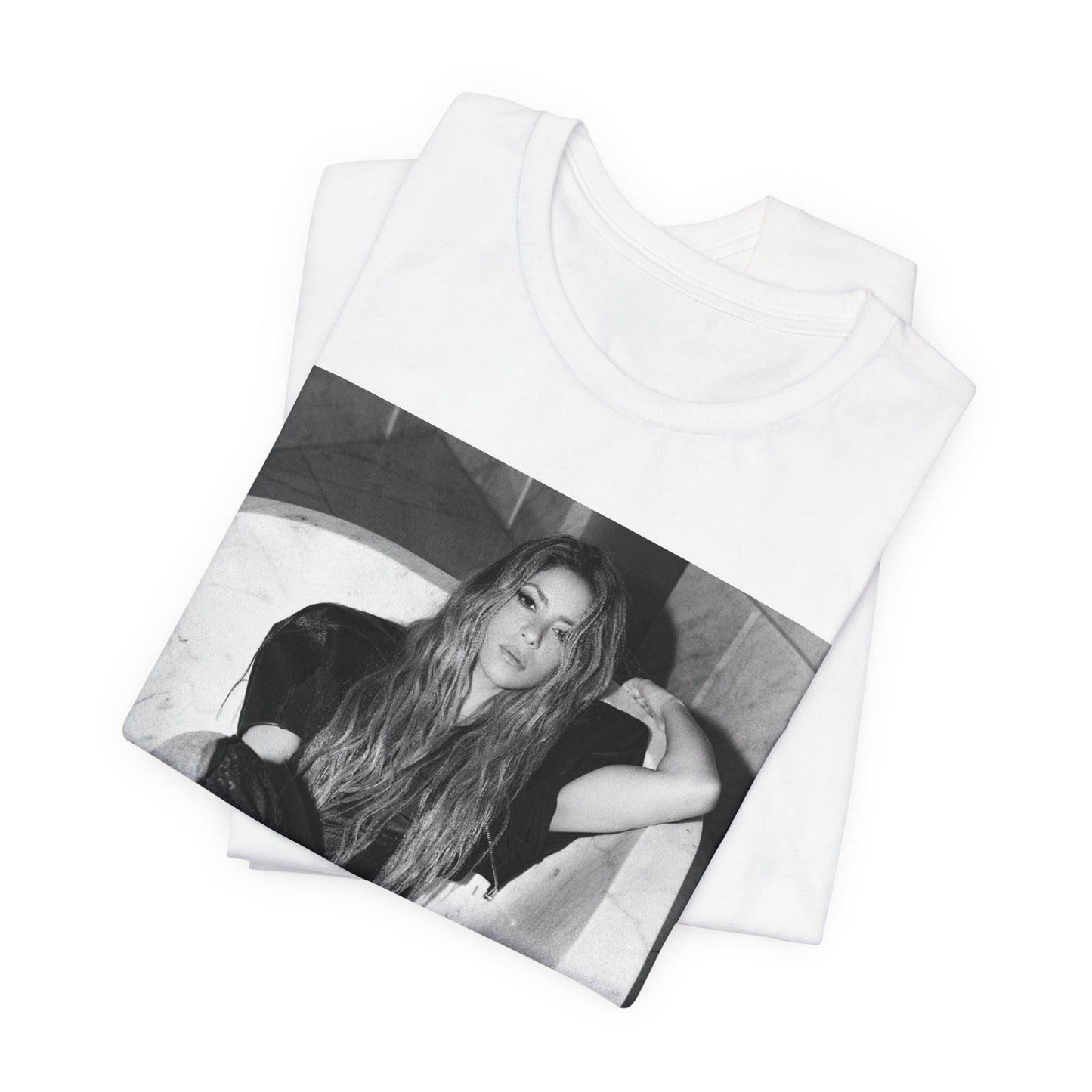 A black graphic t-shirt featuring a retro graphic related to Shakira's 'Hips Don't Lie' song or era.