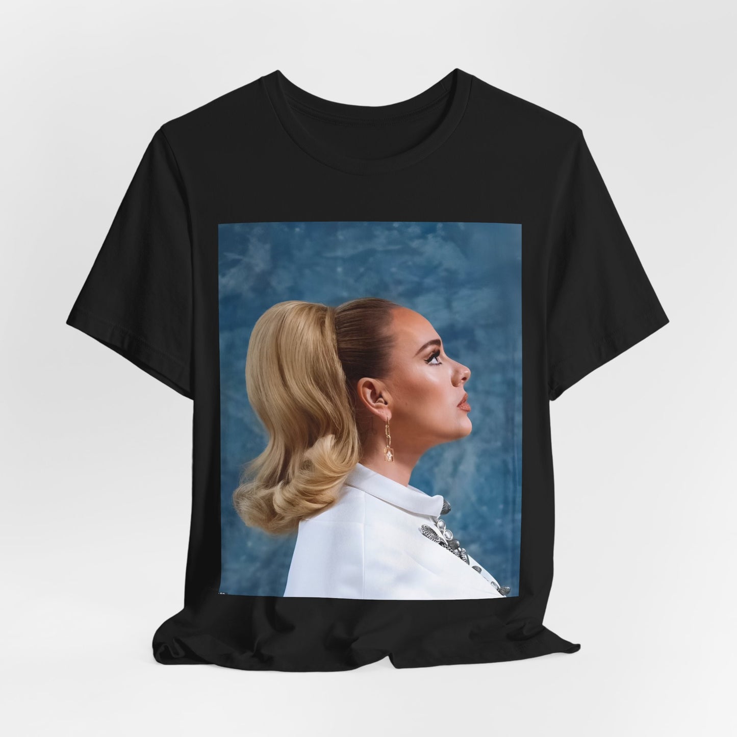 A black graphic t-shirt featuring a black and white photo of Adele in a vintage glamorous look, with classic hair and makeup.