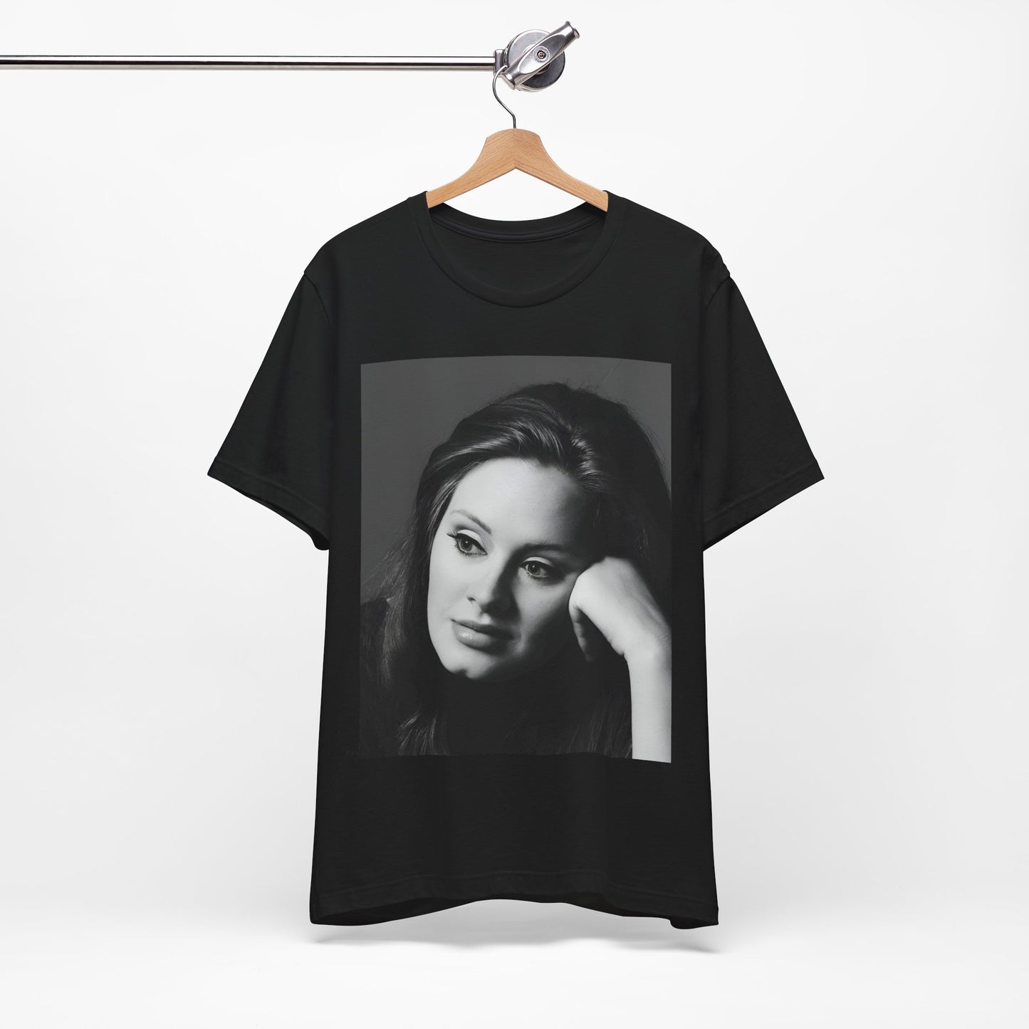 A black graphic t-shirt featuring a vintage-style black and white studio portrait of Adele, showing her with a poised and elegant expression.