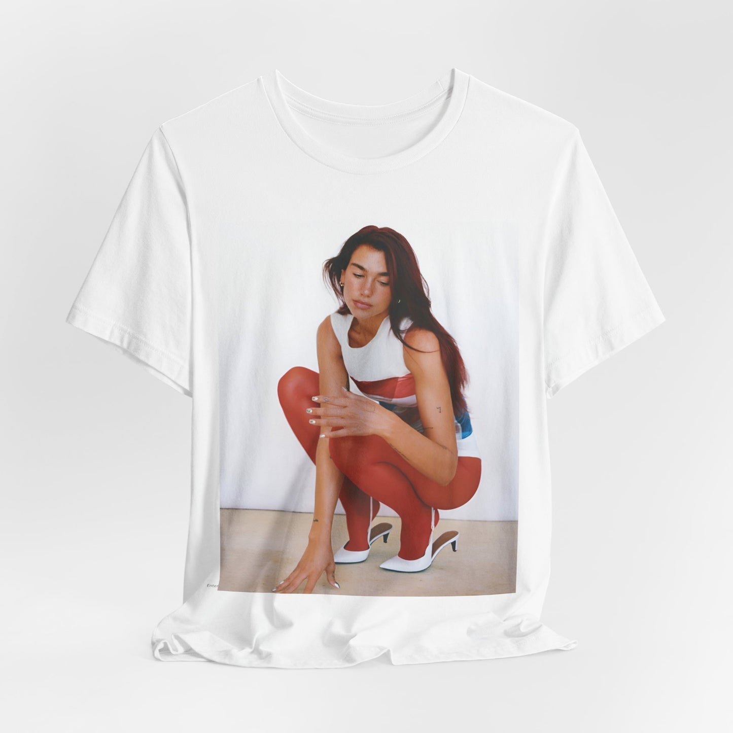 A black graphic t-shirt featuring a graphic of Dua Lipa with a chill pop vibe, designed for comfort.