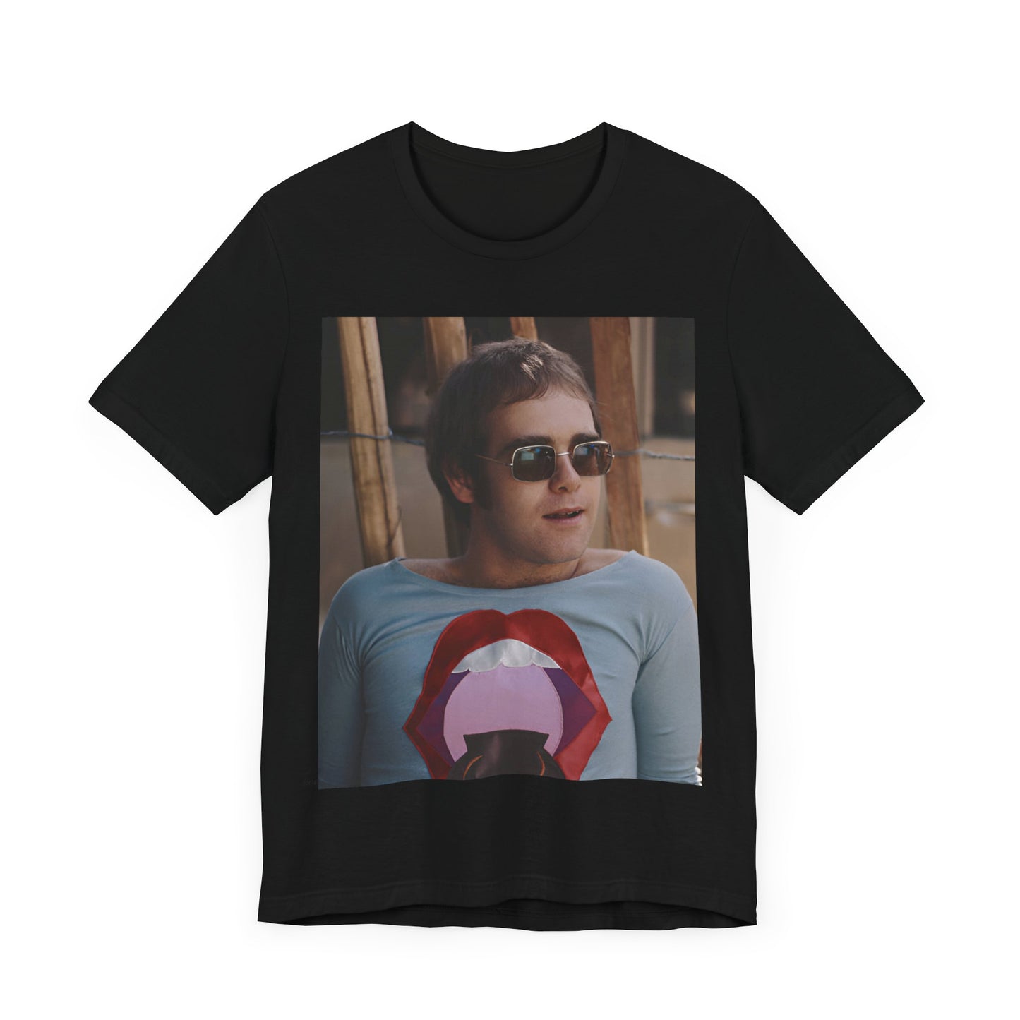 A black graphic t-shirt featuring a classic graphic related to Elton John's 'Tiny Dancer' song or era.