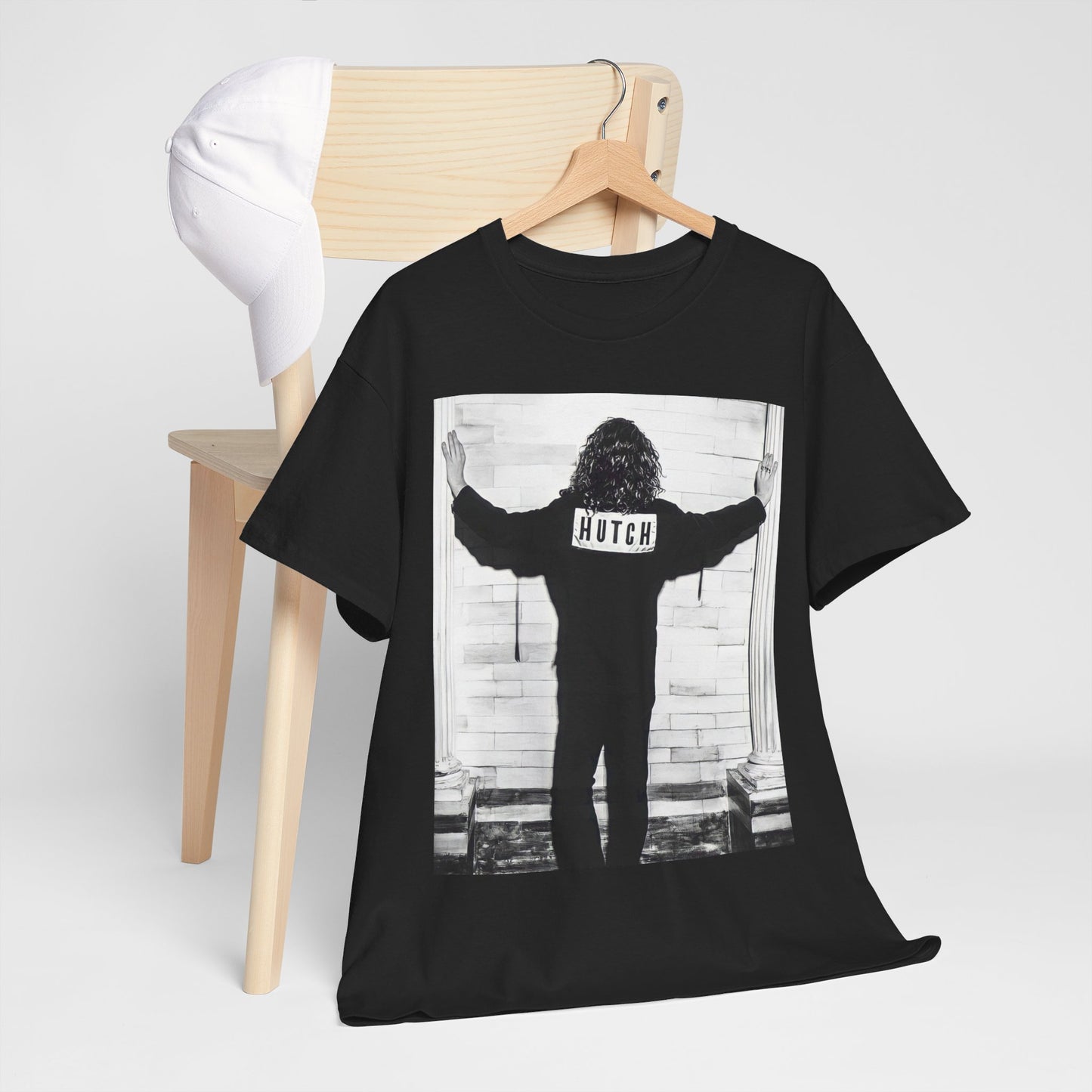 A black graphic t-shirt featuring a graphic of Michael Hutchence from INXS, labeled 'Hutch'.