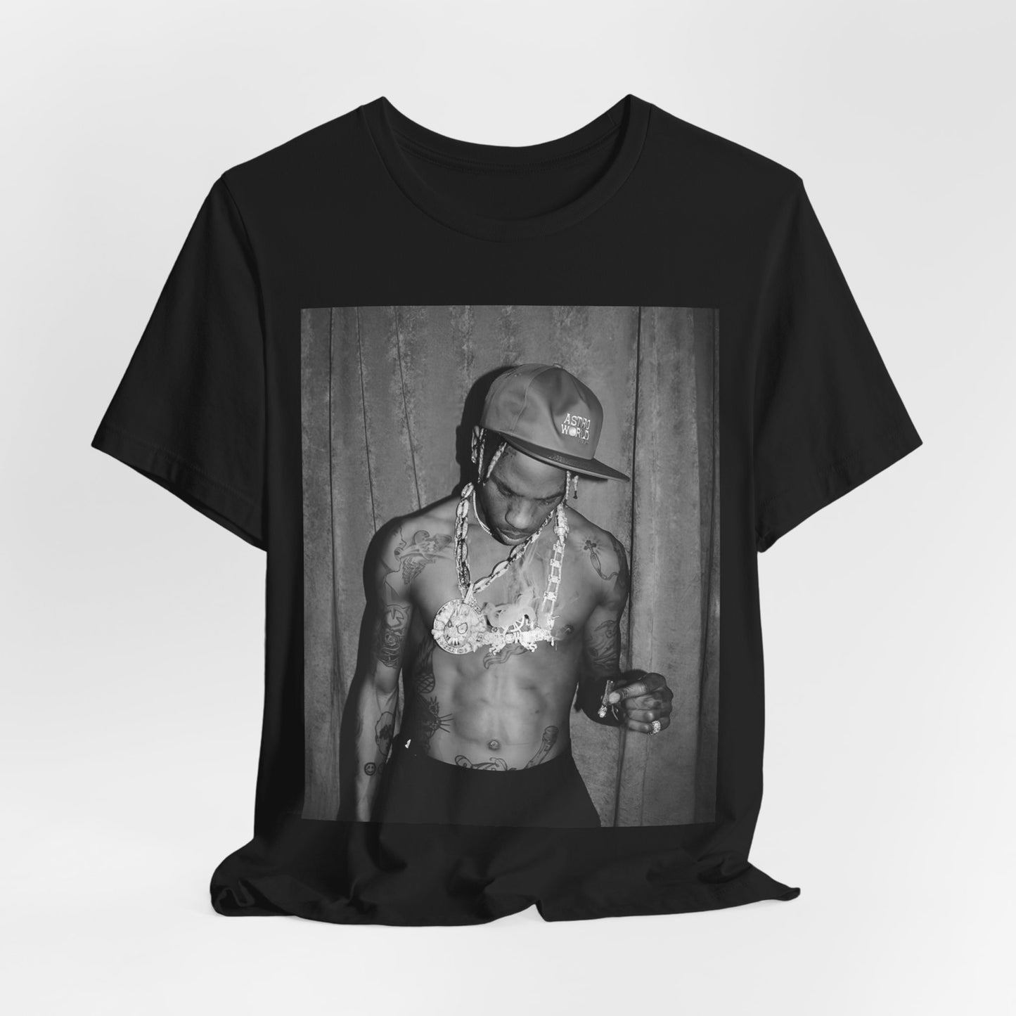 A black graphic t-shirt featuring a graphic of Travis Scott as the Houston rap king.