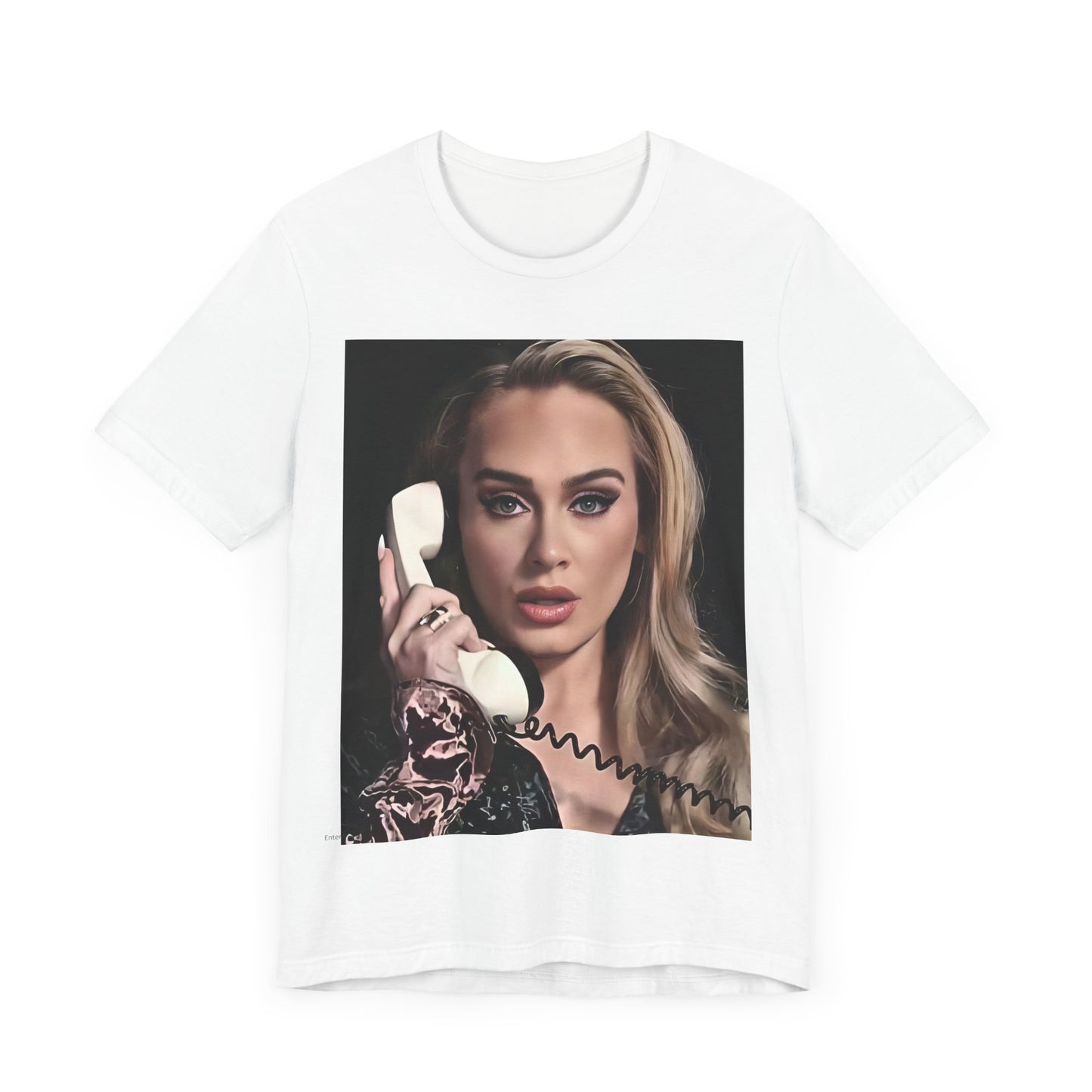 A black graphic t-shirt featuring a black and white candid photo of Adele with a phone to her ear, showing a thoughtful or emotional expression.