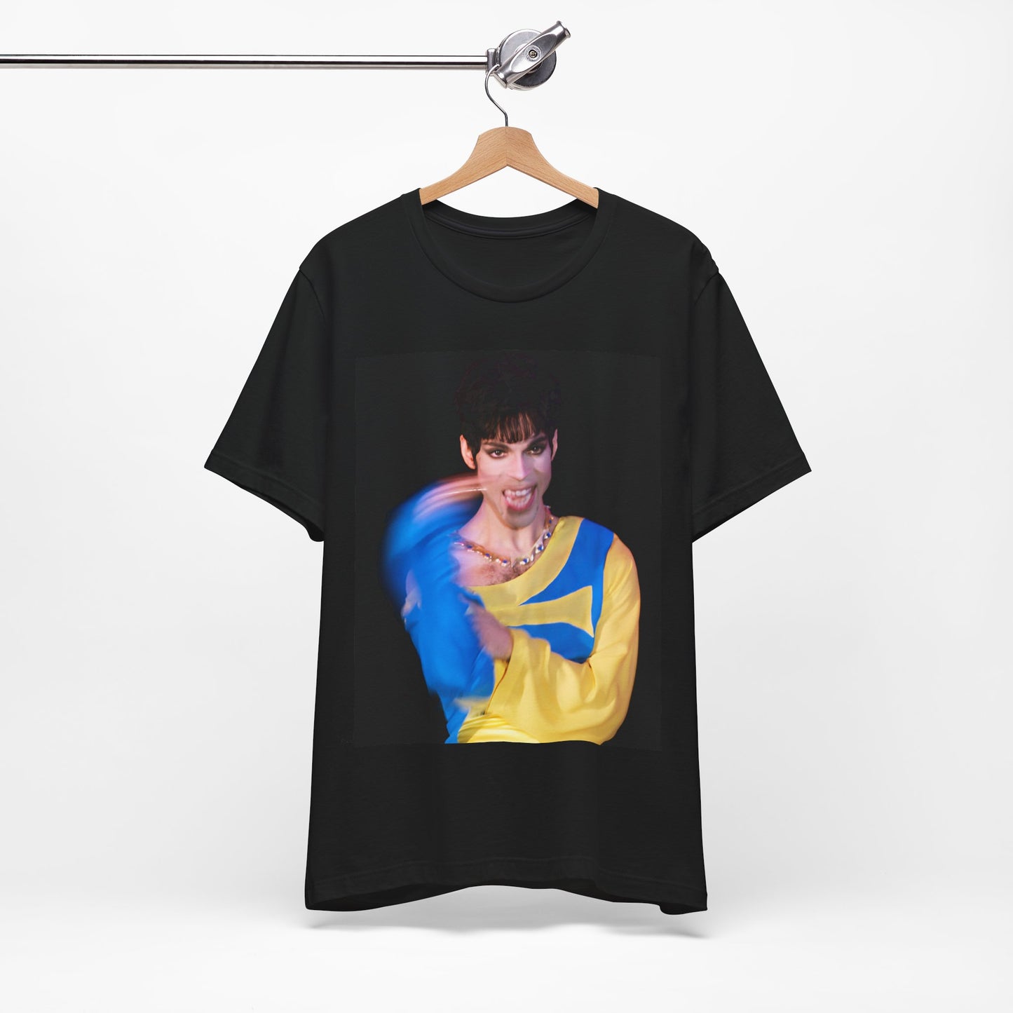 A black graphic t-shirt featuring a graphic related to Prince's 'When Doves Cry' song or era.