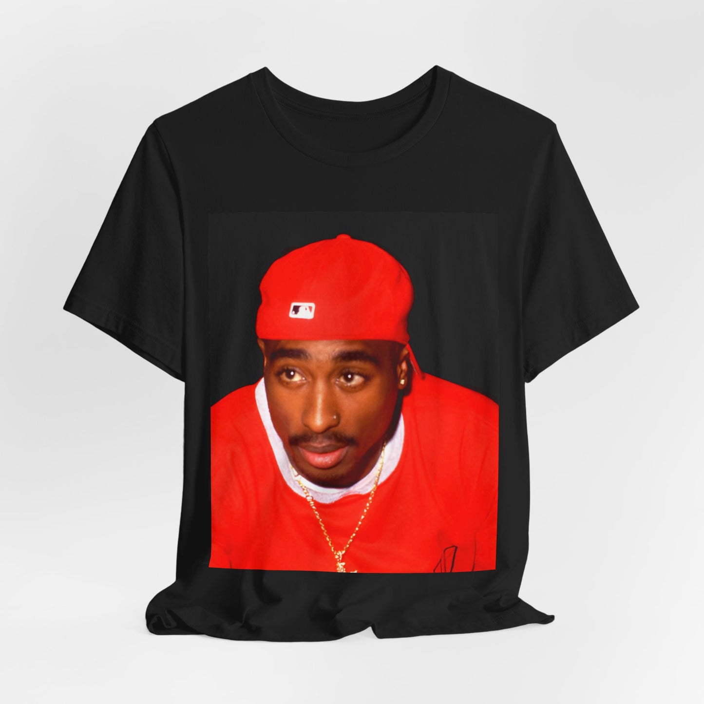 A black graphic t-shirt featuring a fierce graphic related to Tupac's 'California Love' song or era.
