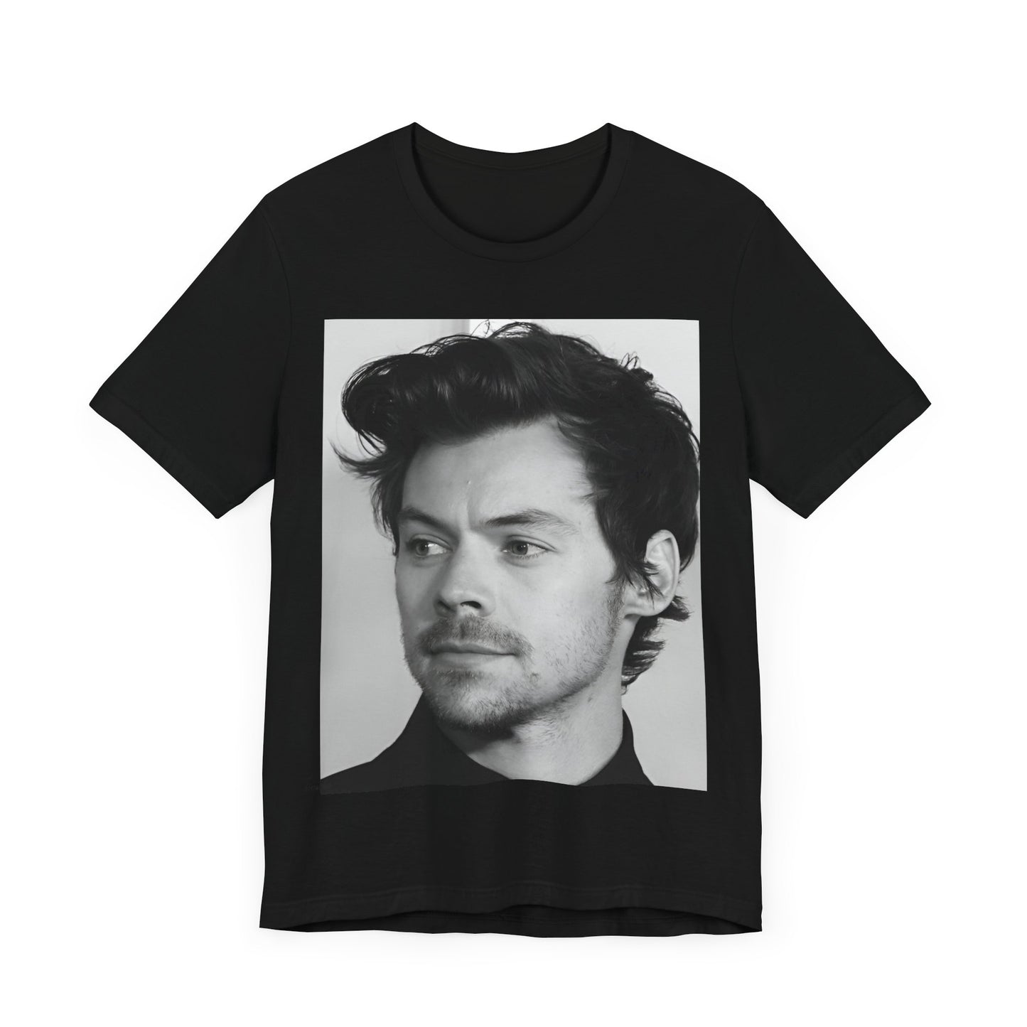 A black graphic t-shirt featuring a black and white, monochrome graphic or photo of Harry Styles.