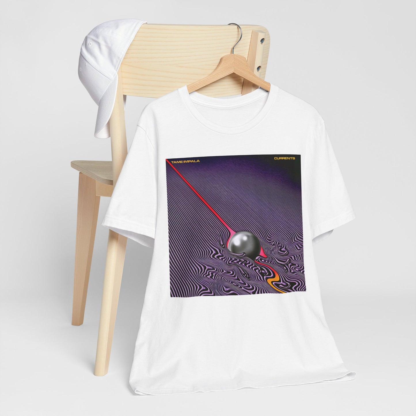A black graphic t-shirt featuring a graphic related to Tame Impala's 'Currents' album.