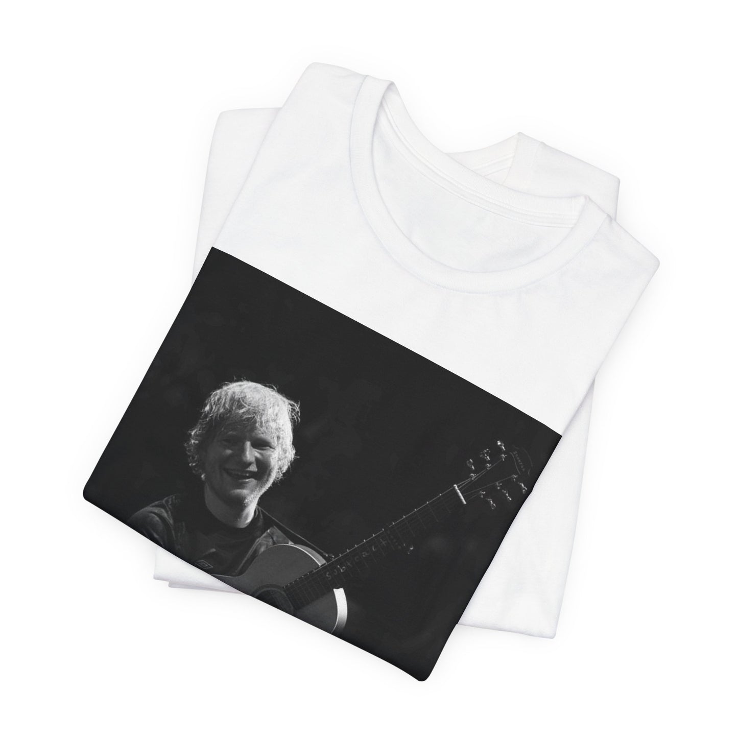 A black graphic t-shirt featuring a photo of Ed Sheeran performing live with his guitar.