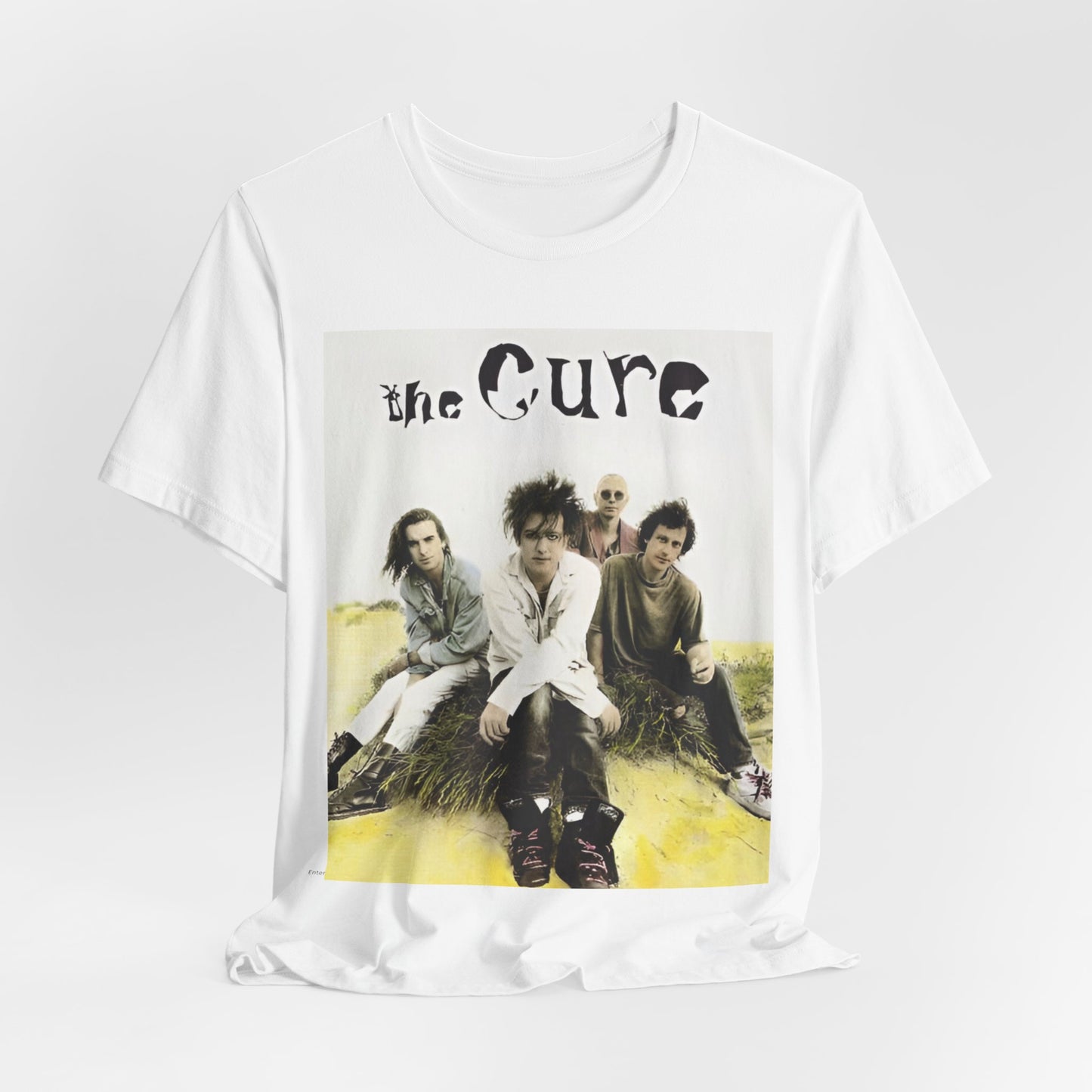 A black graphic t-shirt featuring a graphic of The Cure as post-punk pioneers.