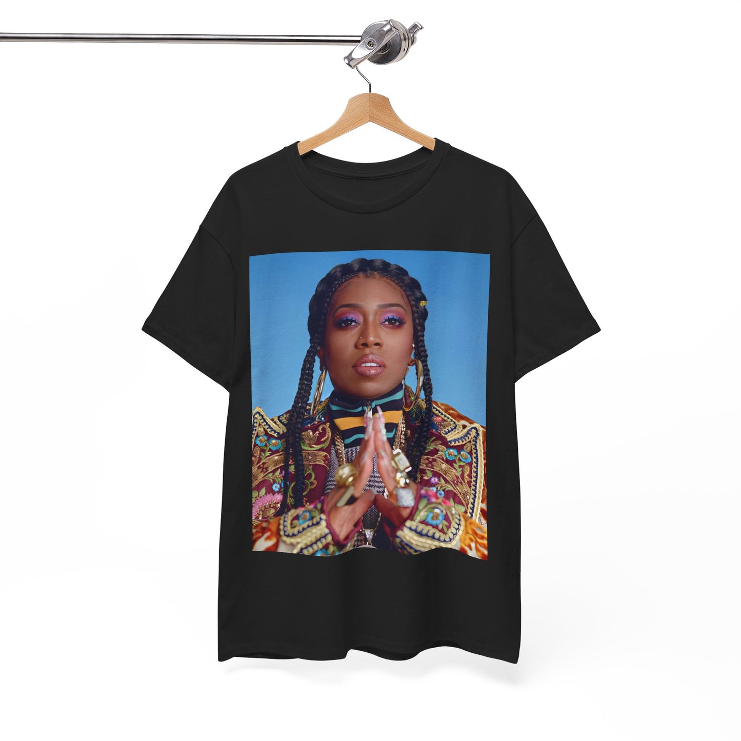 A black graphic t-shirt featuring a graphic of Missy Elliott with a cool, futuristic rap fashion aesthetic.